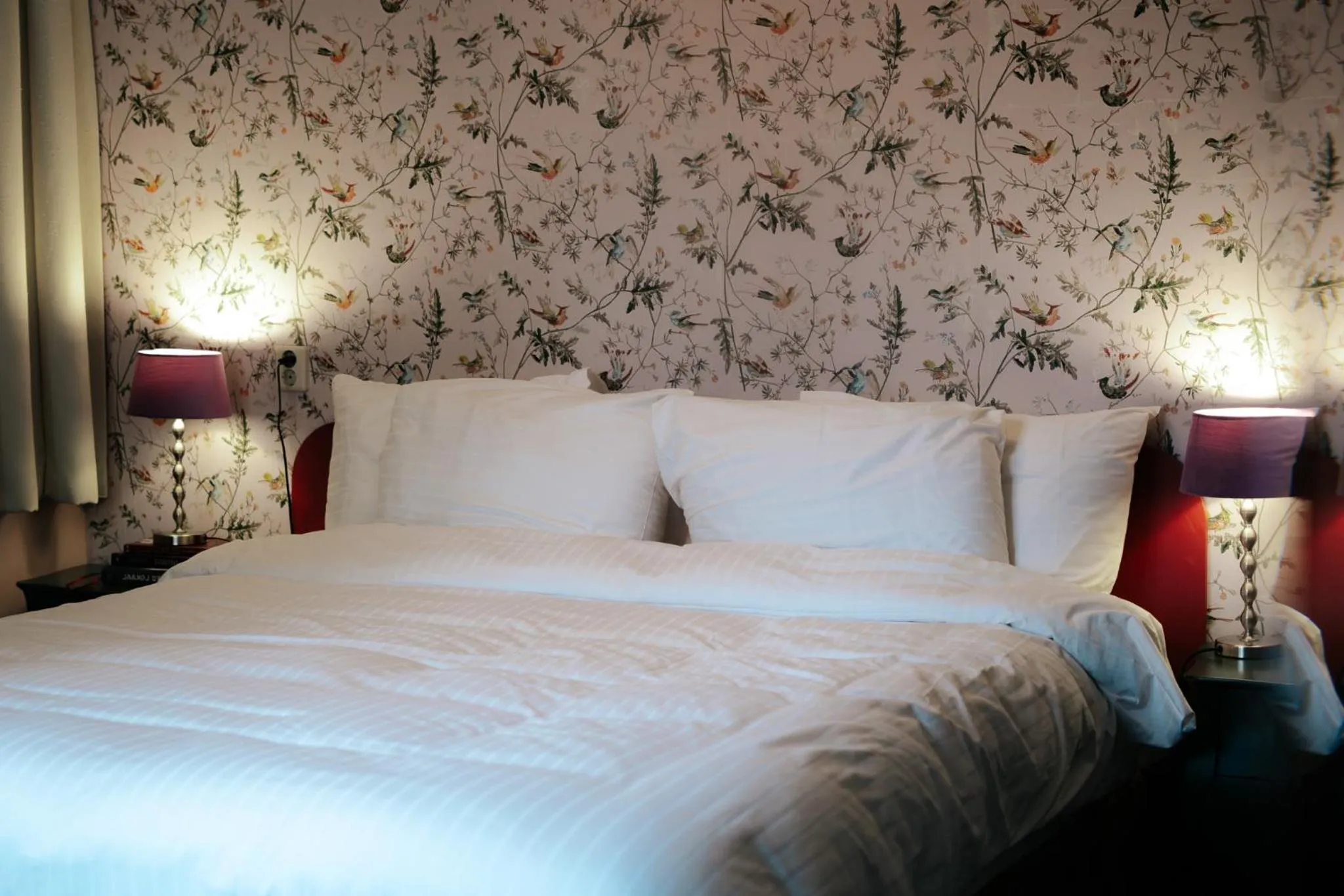 Bed in Rosalia's Menagerie Cocktail bar & InnUpstairs