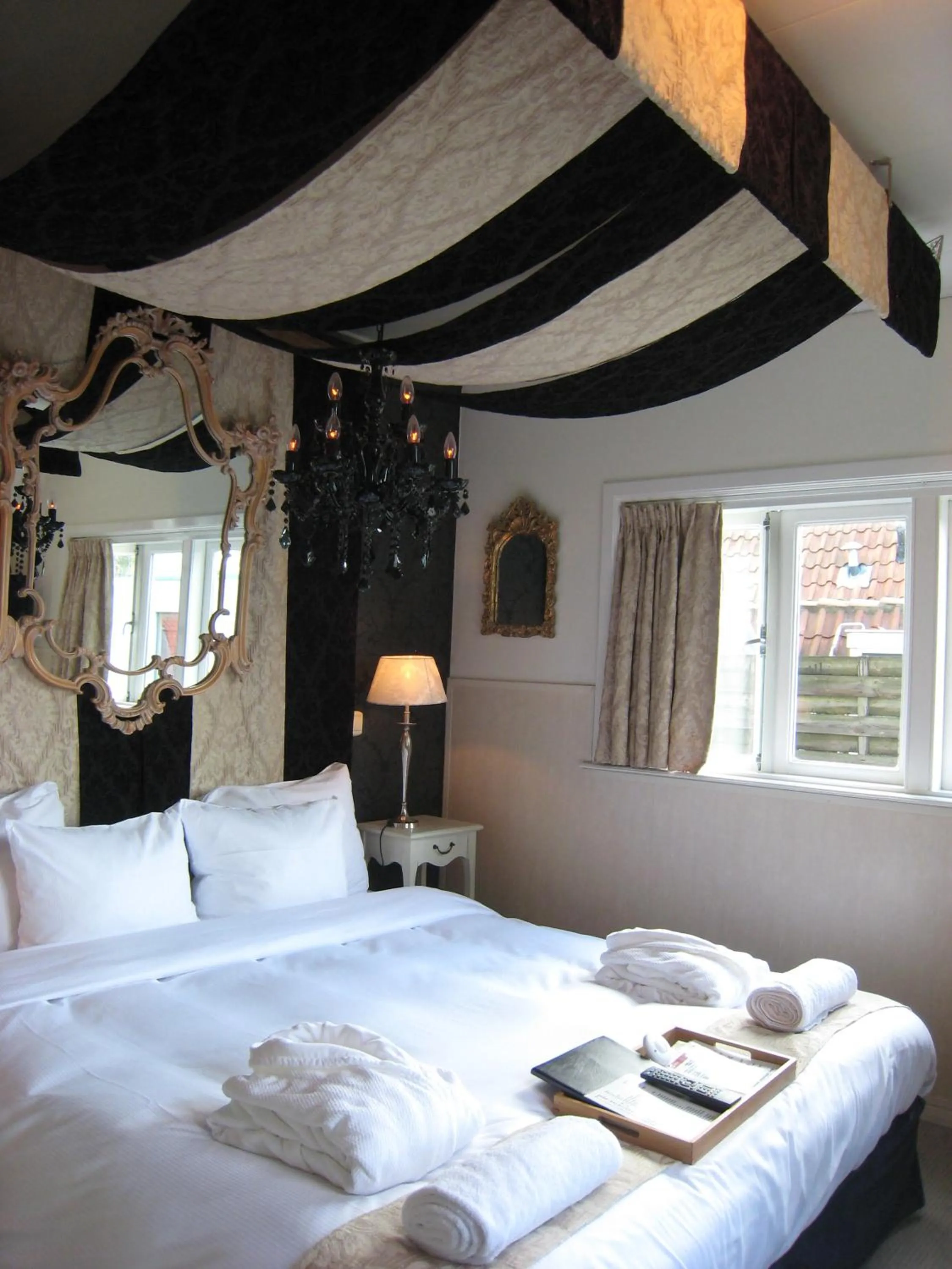 Bed in Rosalia's Menagerie Cocktail bar & InnUpstairs