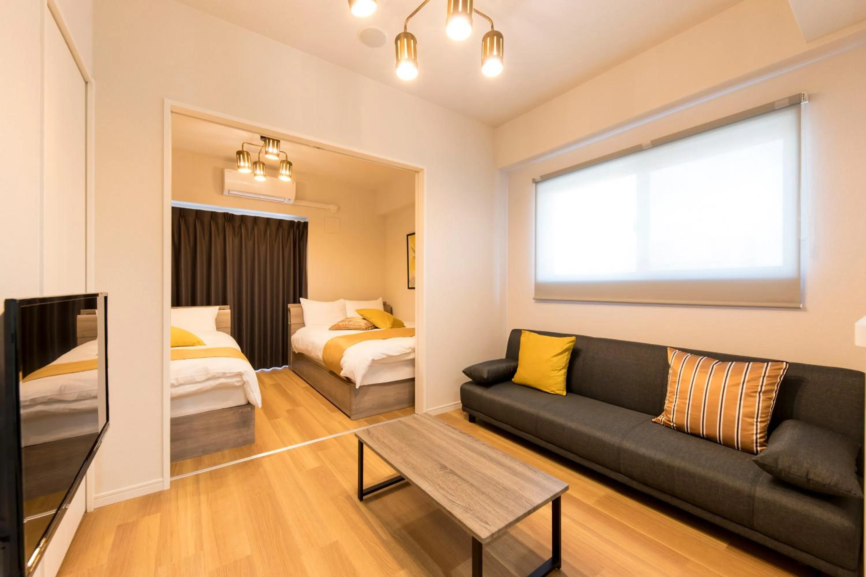 Living room, Bed in Hotel Ritza HAKATA