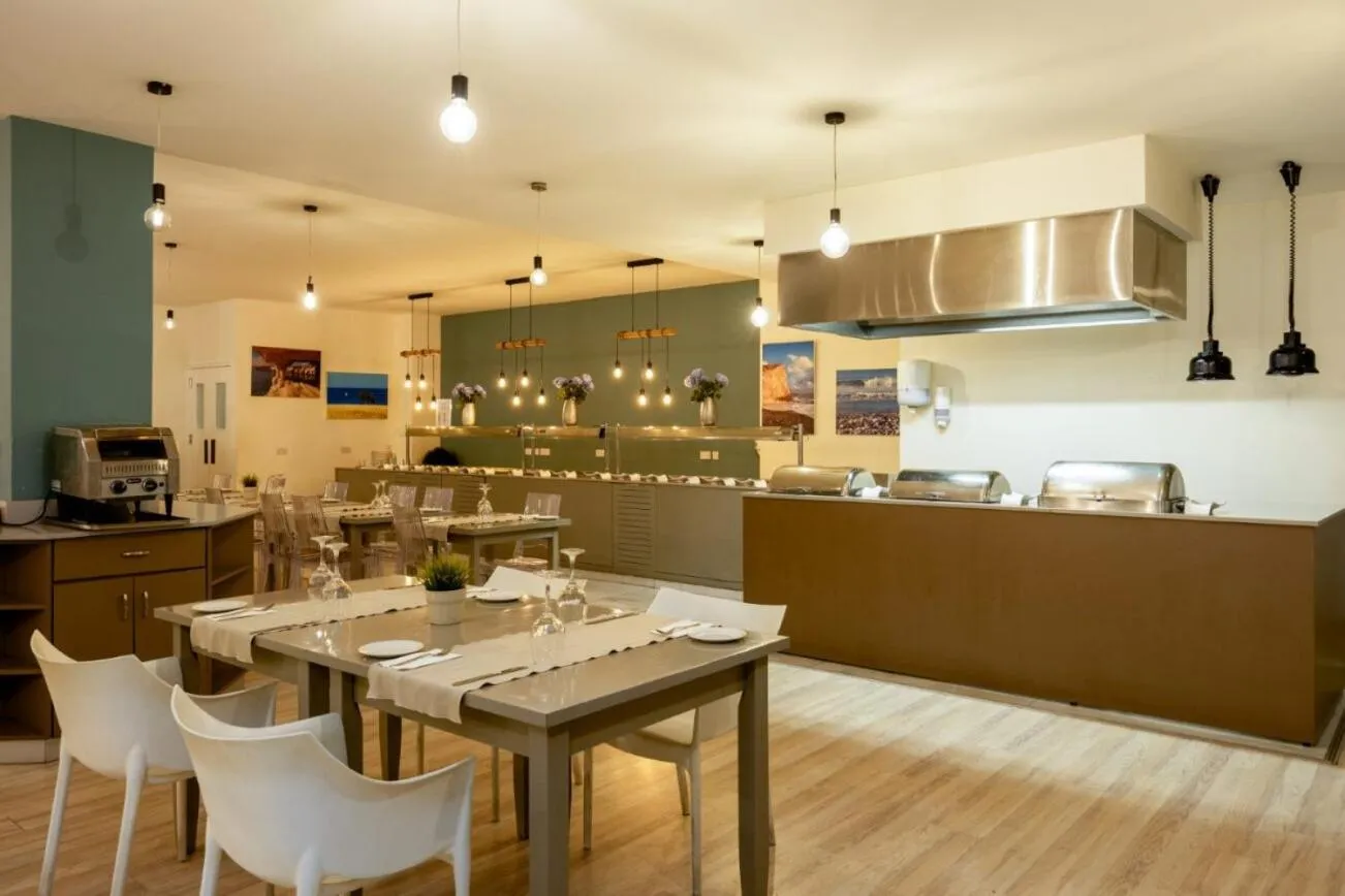 Dining area in Melpo Antia Hotel & Suites