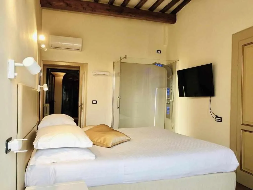 Bed in Mavitur Rooms Assisi