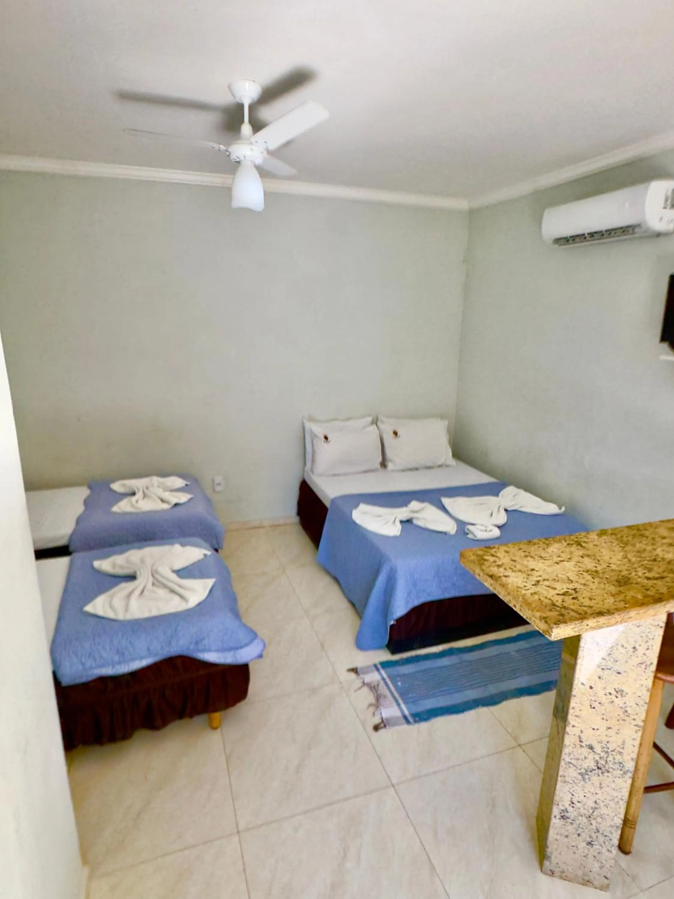 Bed in Pousada Três Pescadores