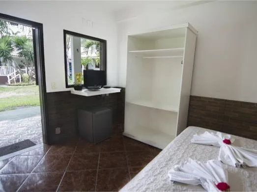 Bed in Pousada Três Pescadores