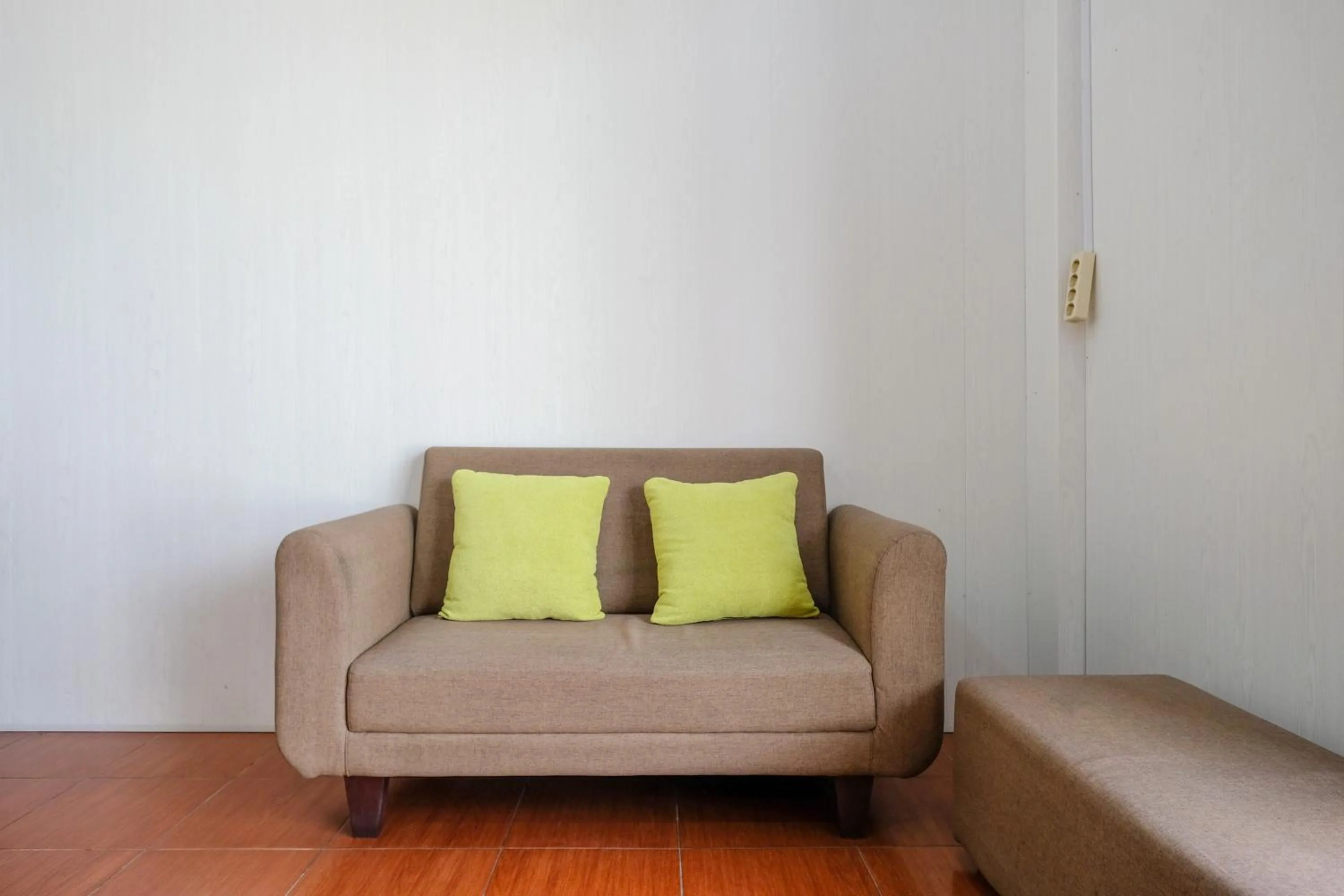 Seating area in RedDoorz at MM Guesthouse Yogyakarta