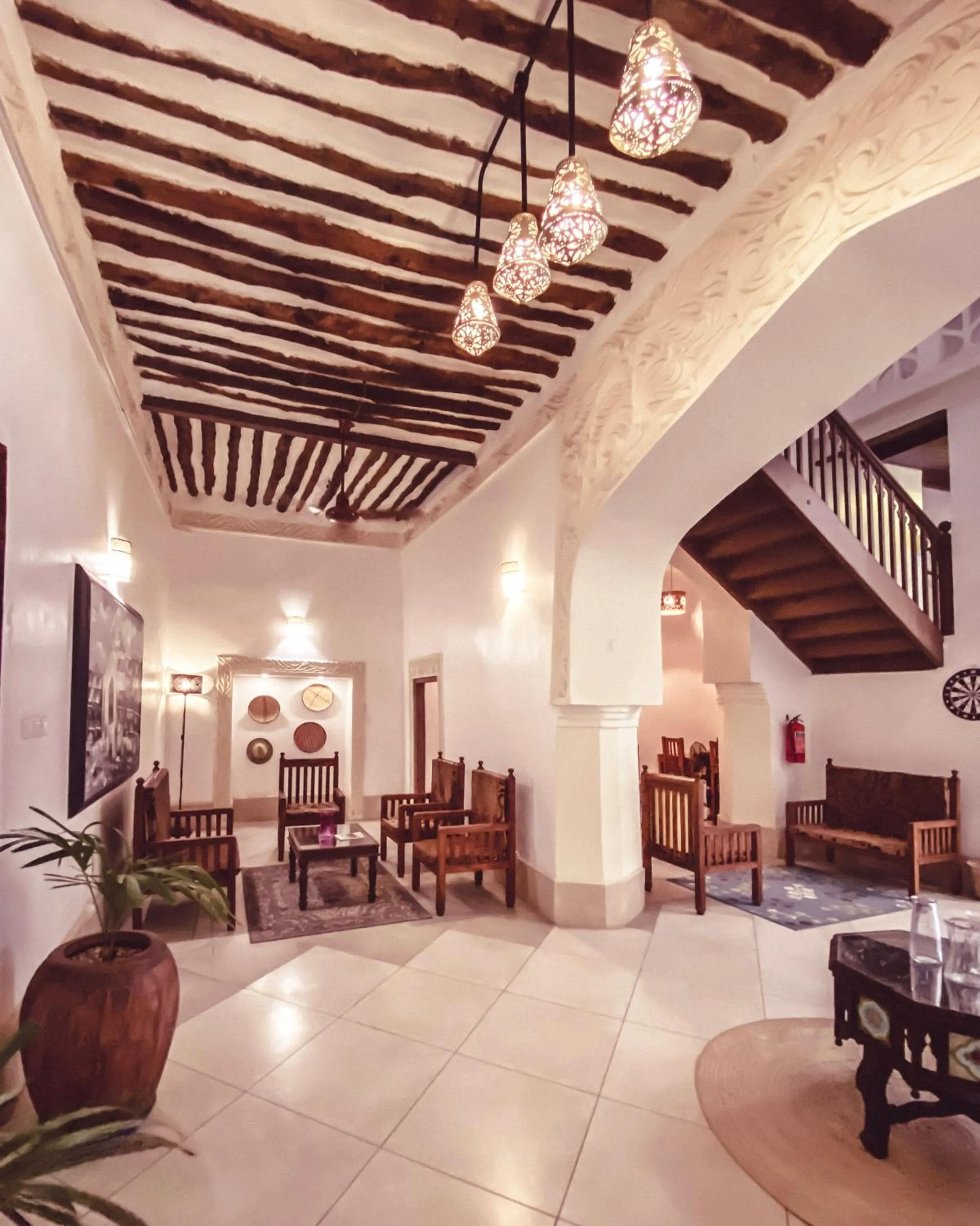 Communal lounge/ TV room in Smiles Stone Town Hotel