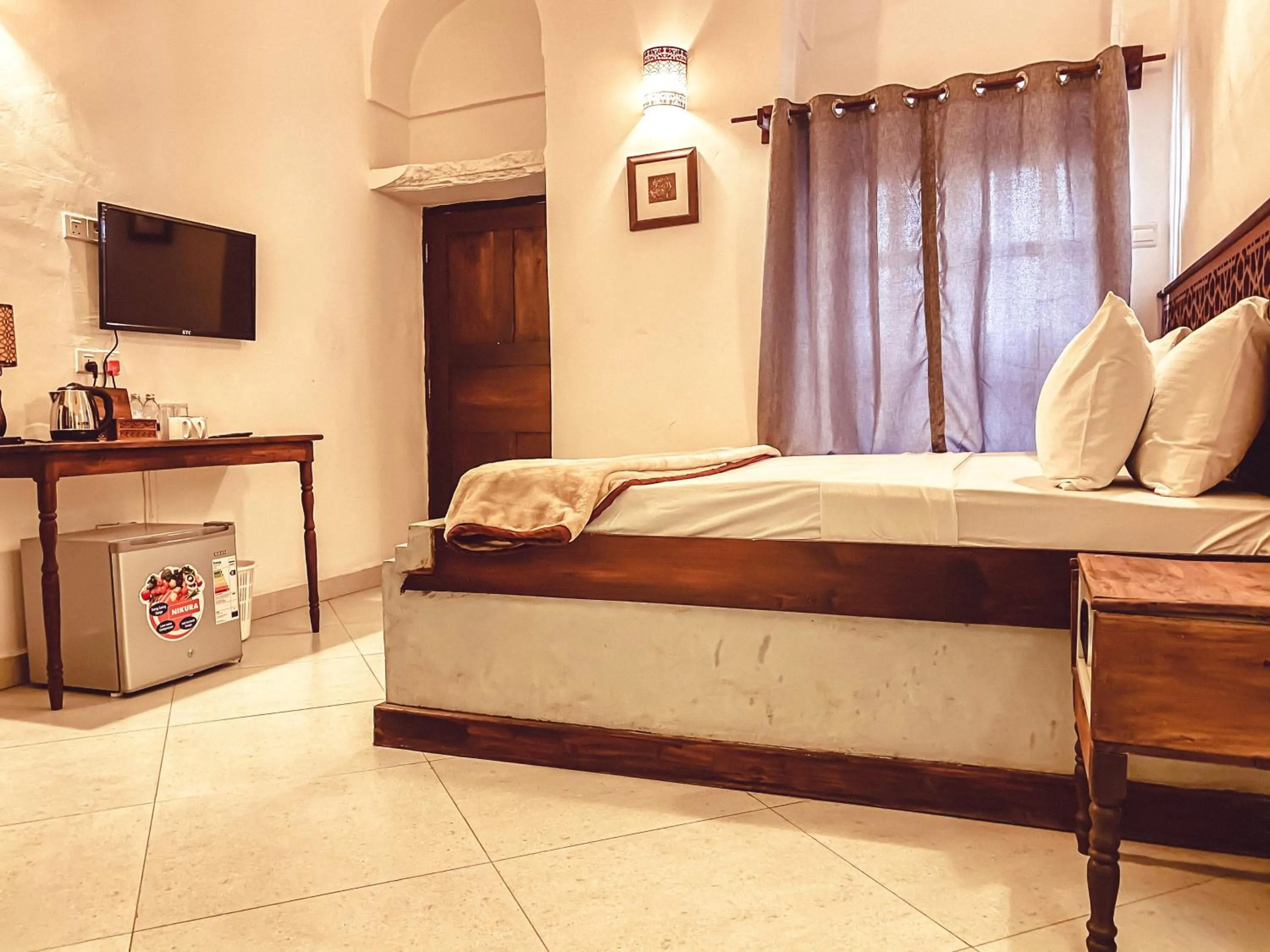 Bed in Smiles Stone Town Hotel