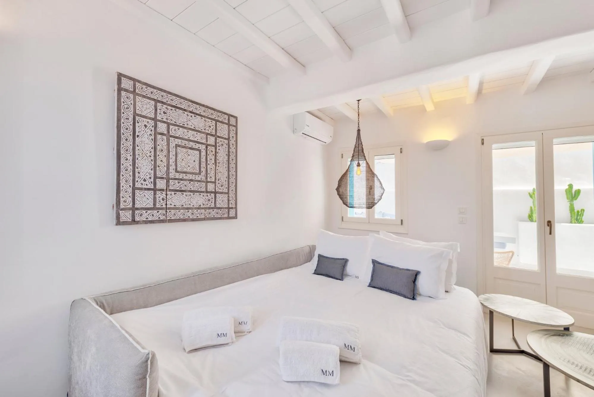 Bed in Mykonian Mews Luxury Suites