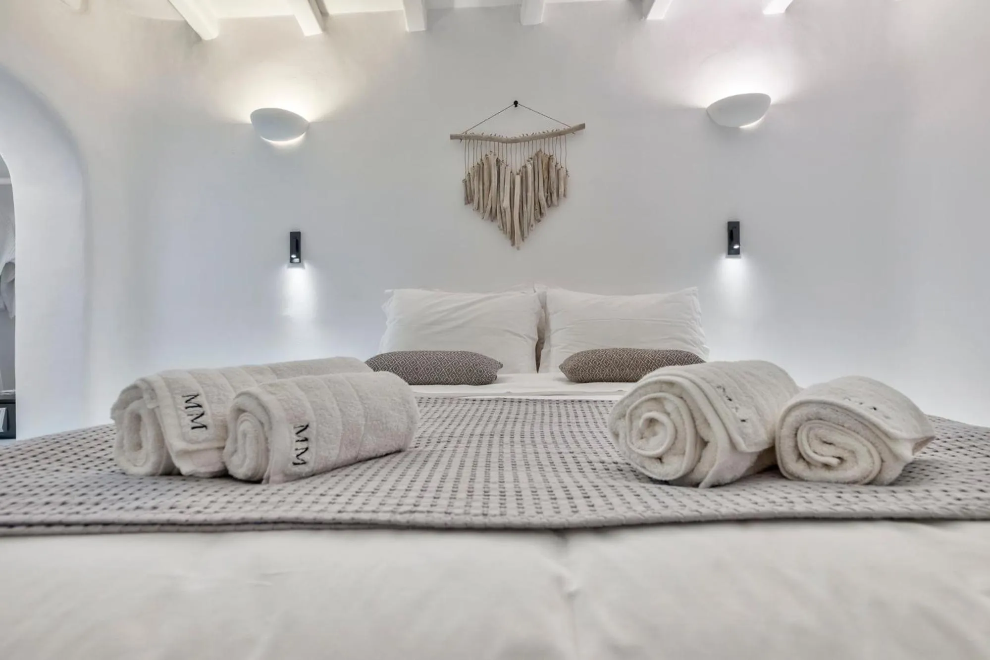 Bed in Mykonian Mews Luxury Suites