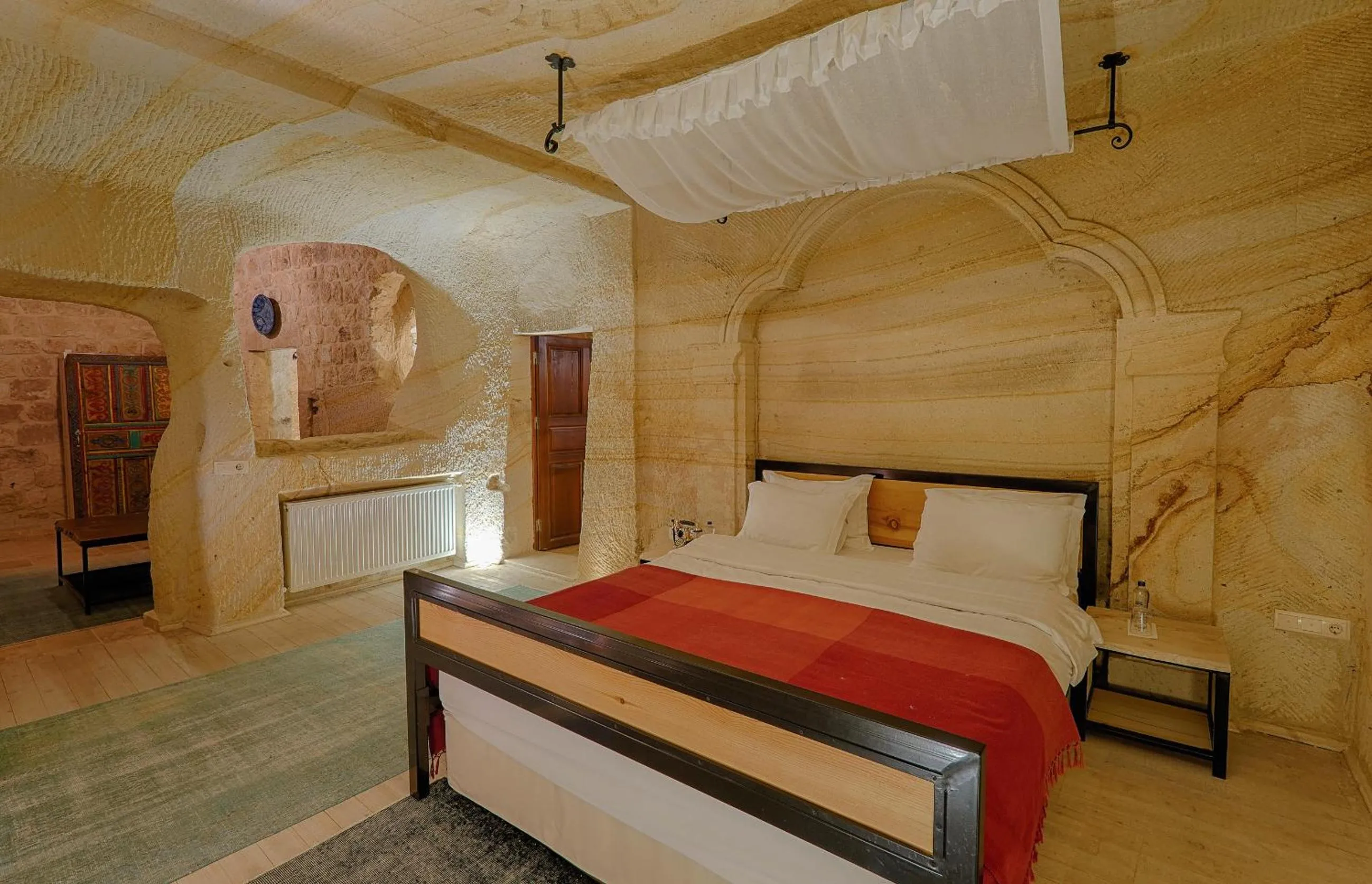 Bed in Taru Cave Suites
