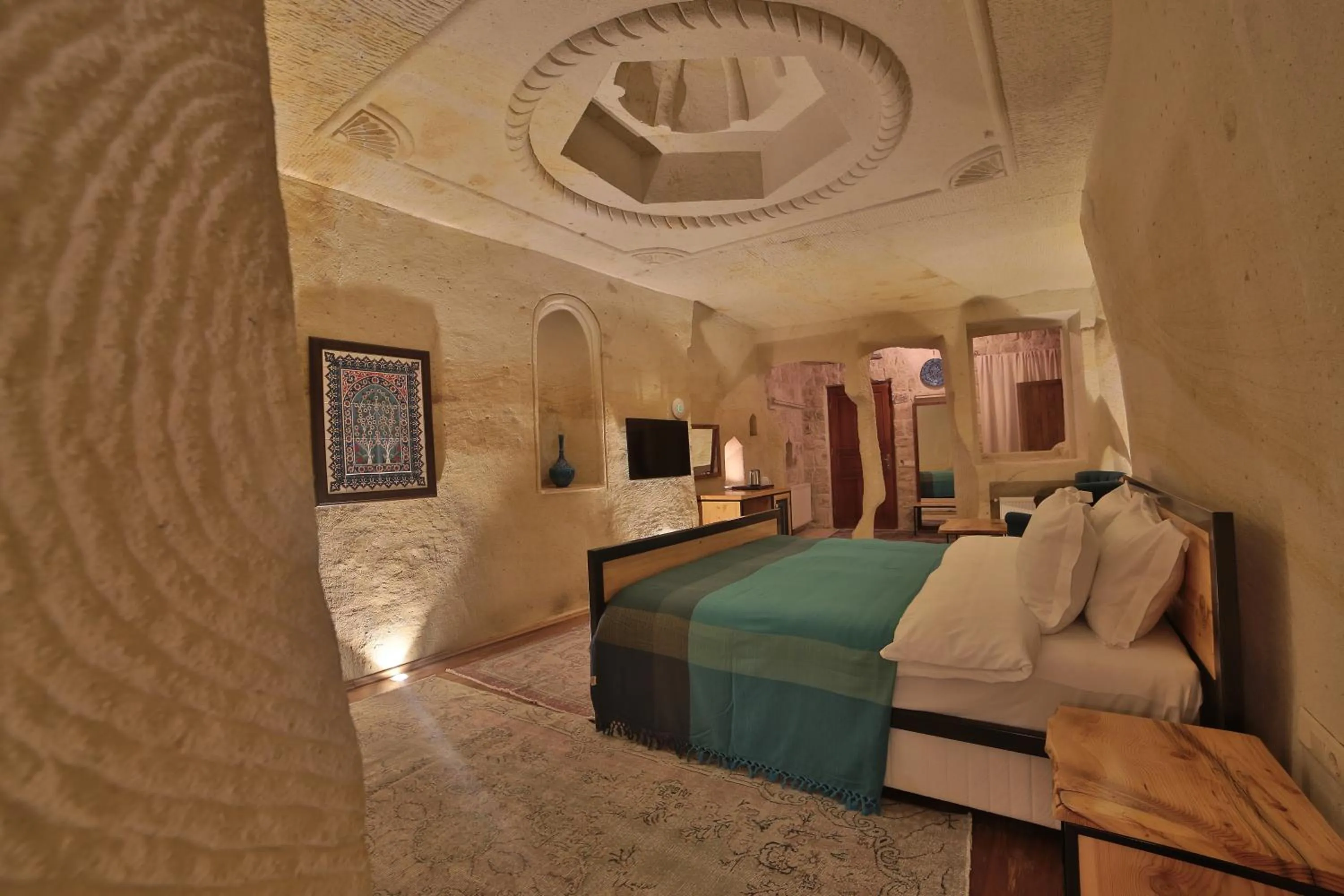 Bed in Taru Cave Suites