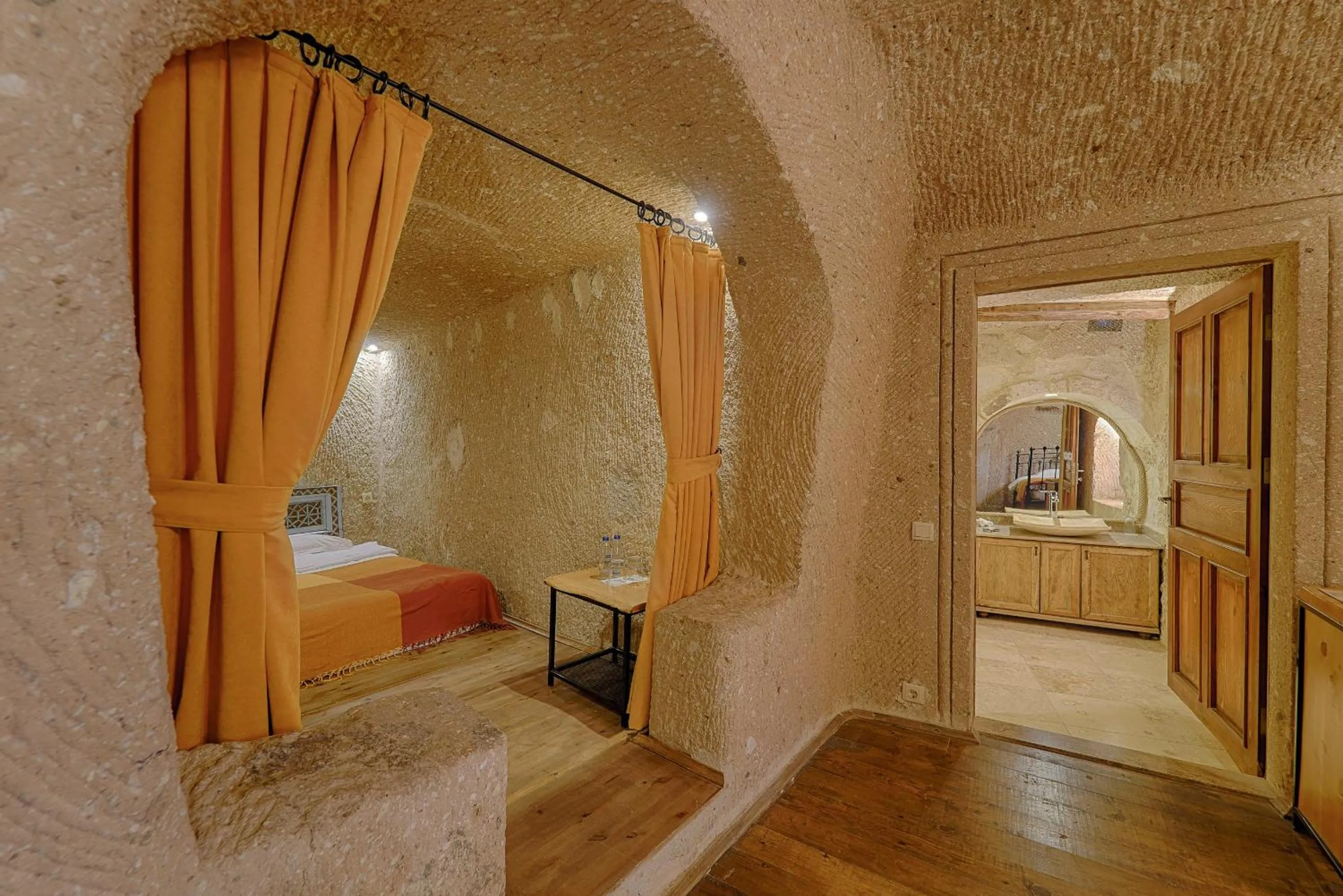 Bed in Taru Cave Suites