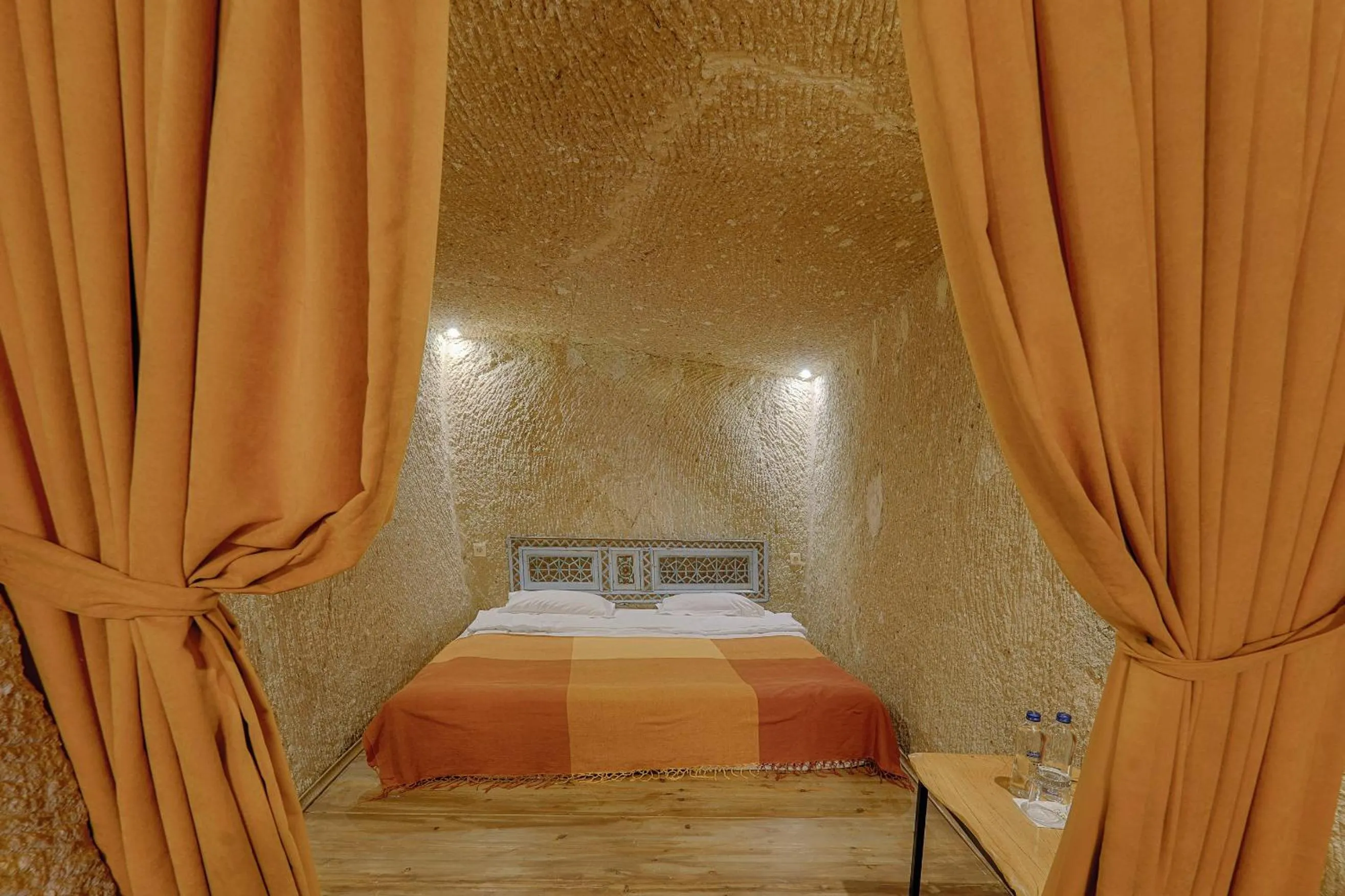 Bed in Taru Cave Suites