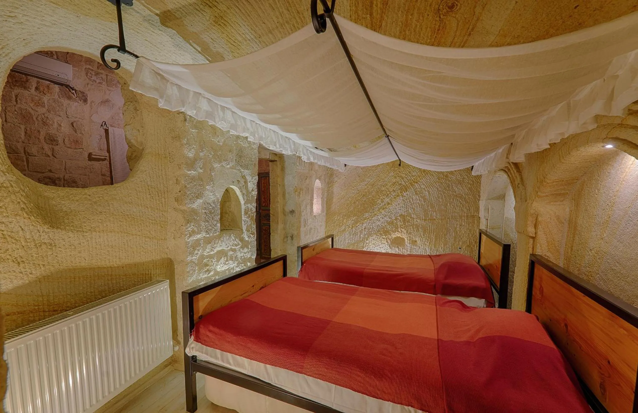Bed in Taru Cave Suites
