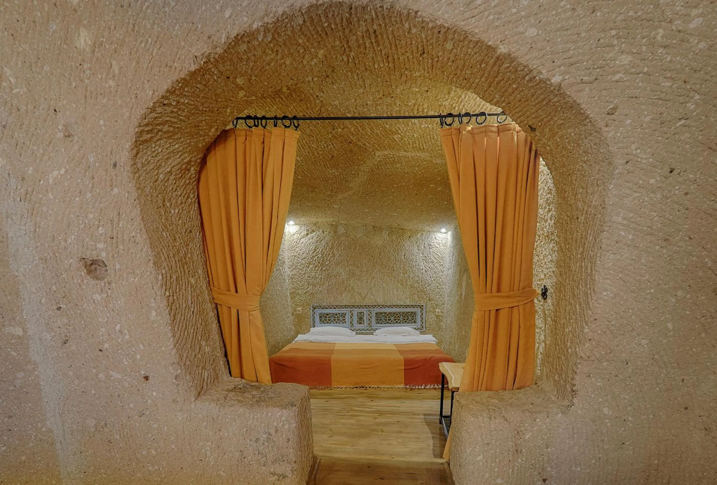 Bed in Taru Cave Suites