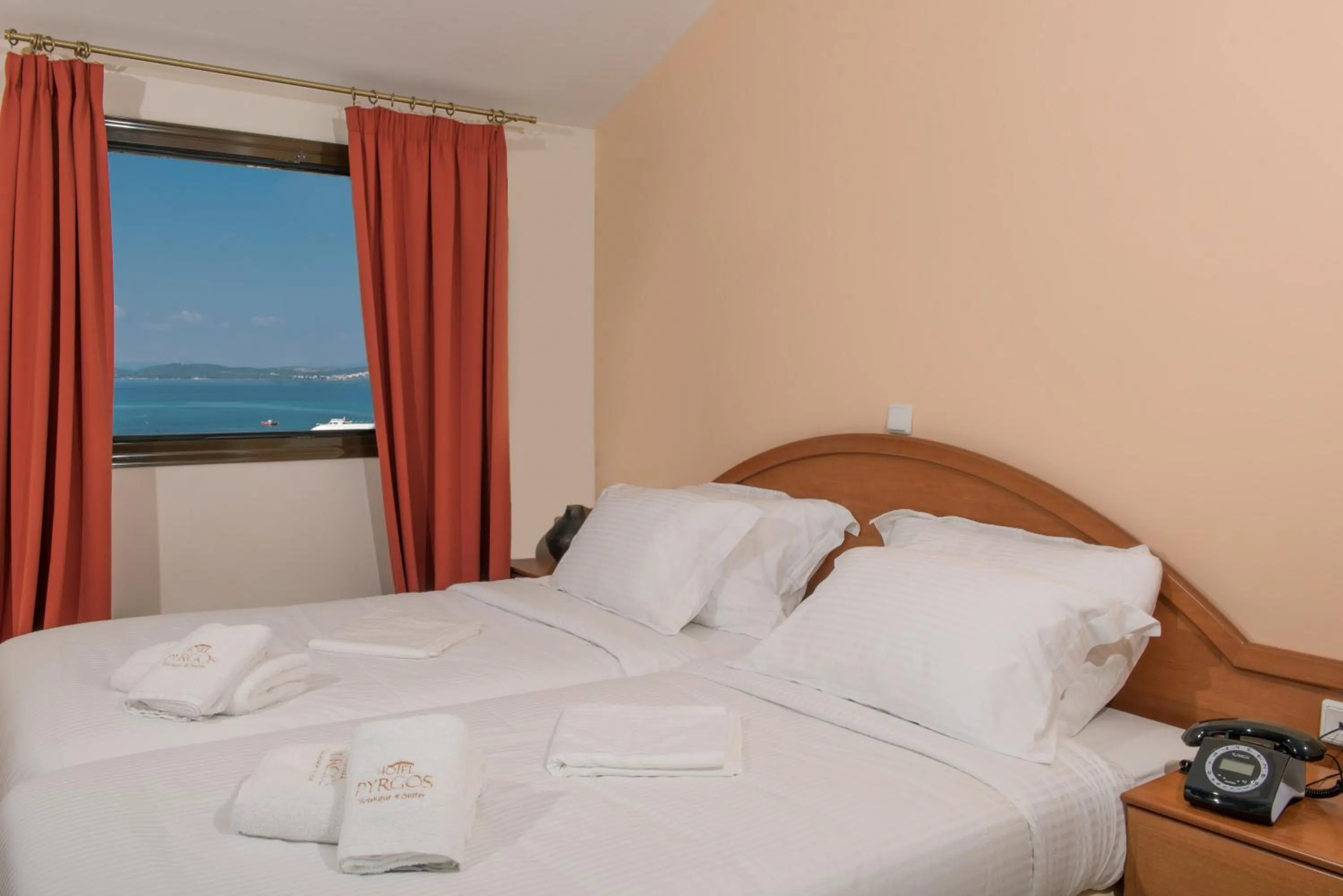 Bed in Pyrgos Hotel