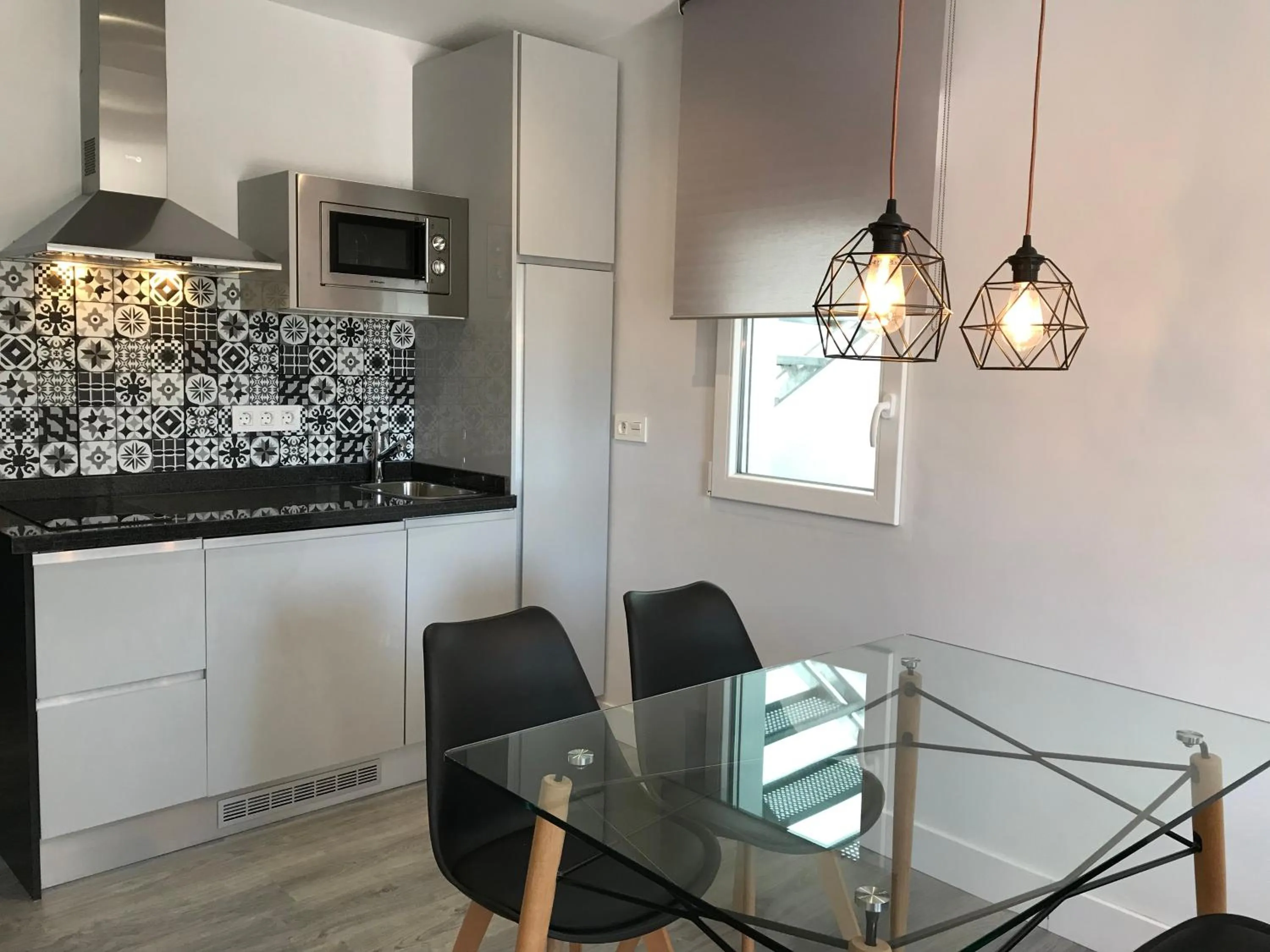 Kitchen or kitchenette in Apartamentos Ciudad de Ronda