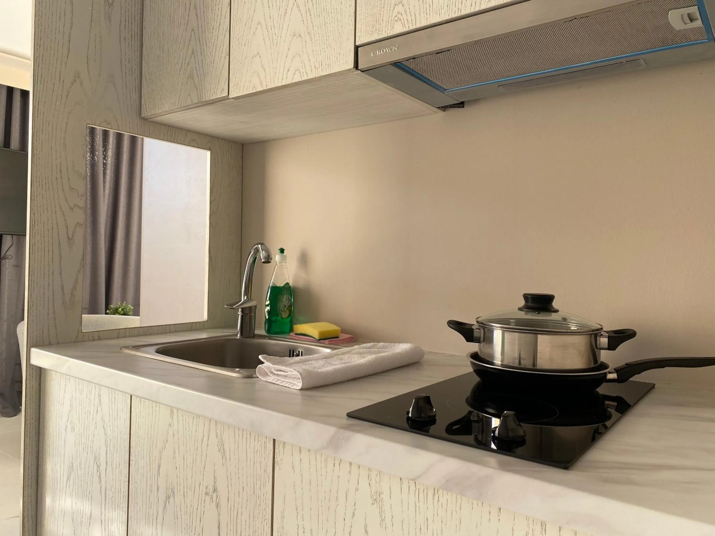 Kitchen or kitchenette in 24K Athena Suites