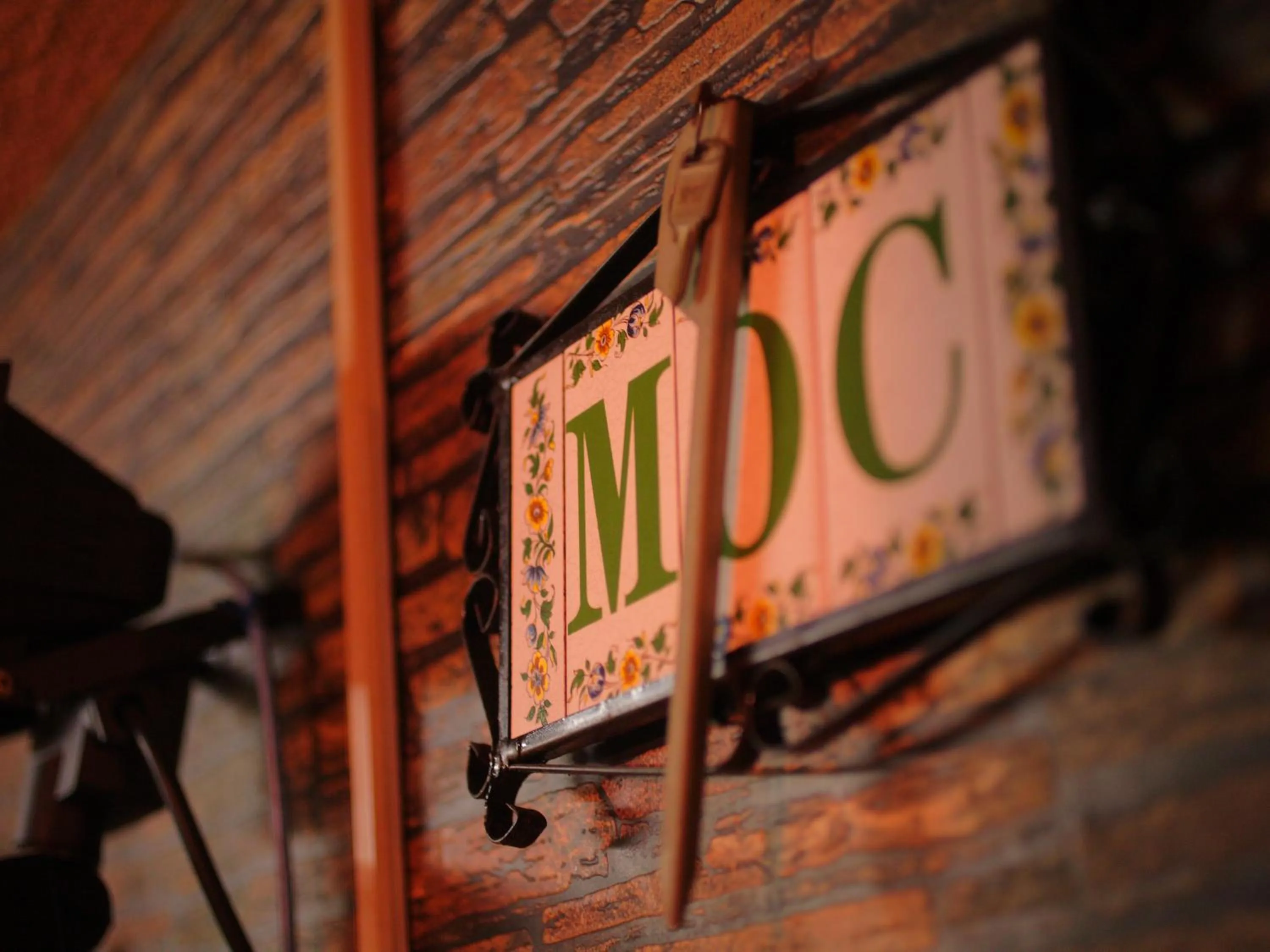 Property logo or sign in Hotel Moc