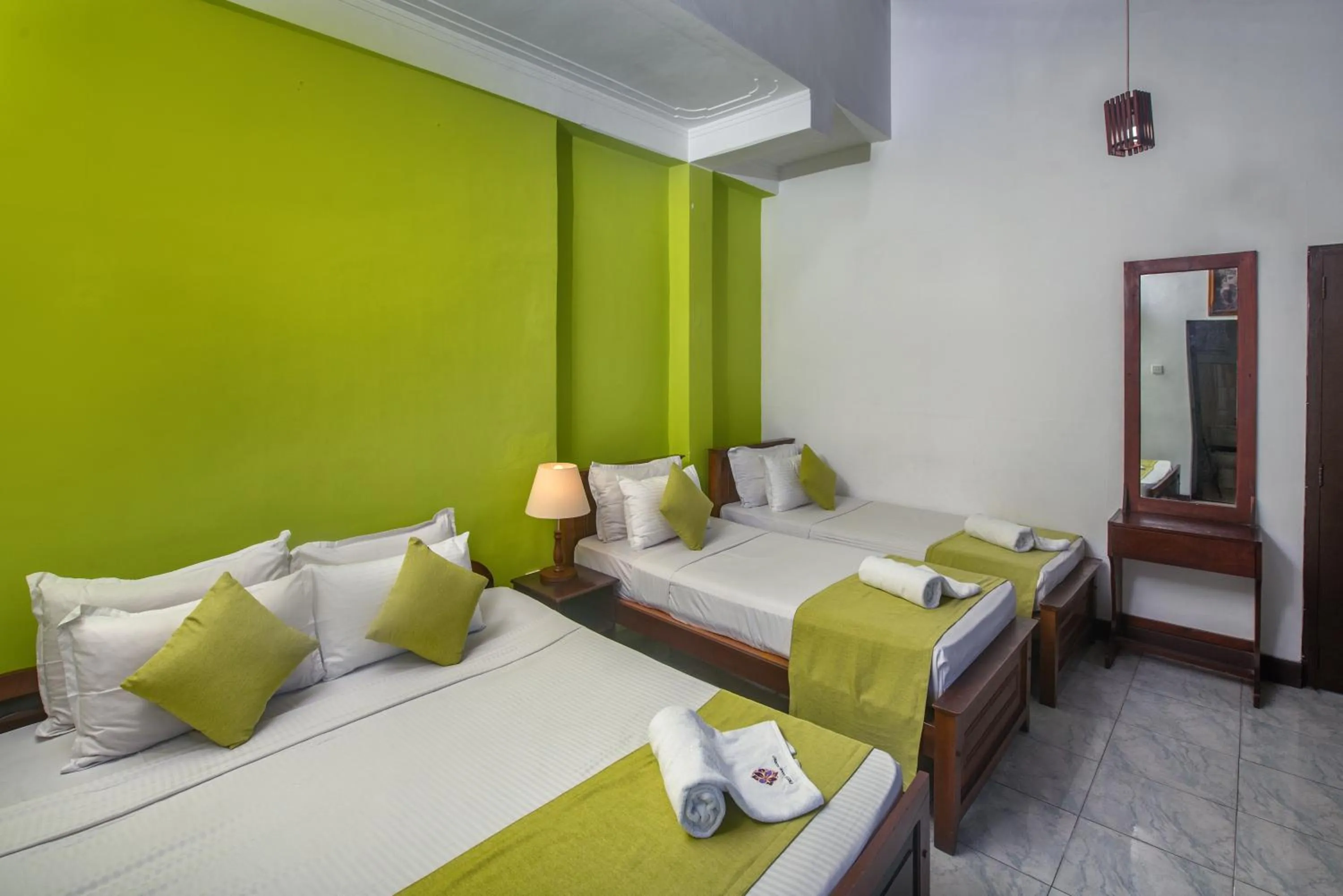 Bed in Ceyloni Lake Residency