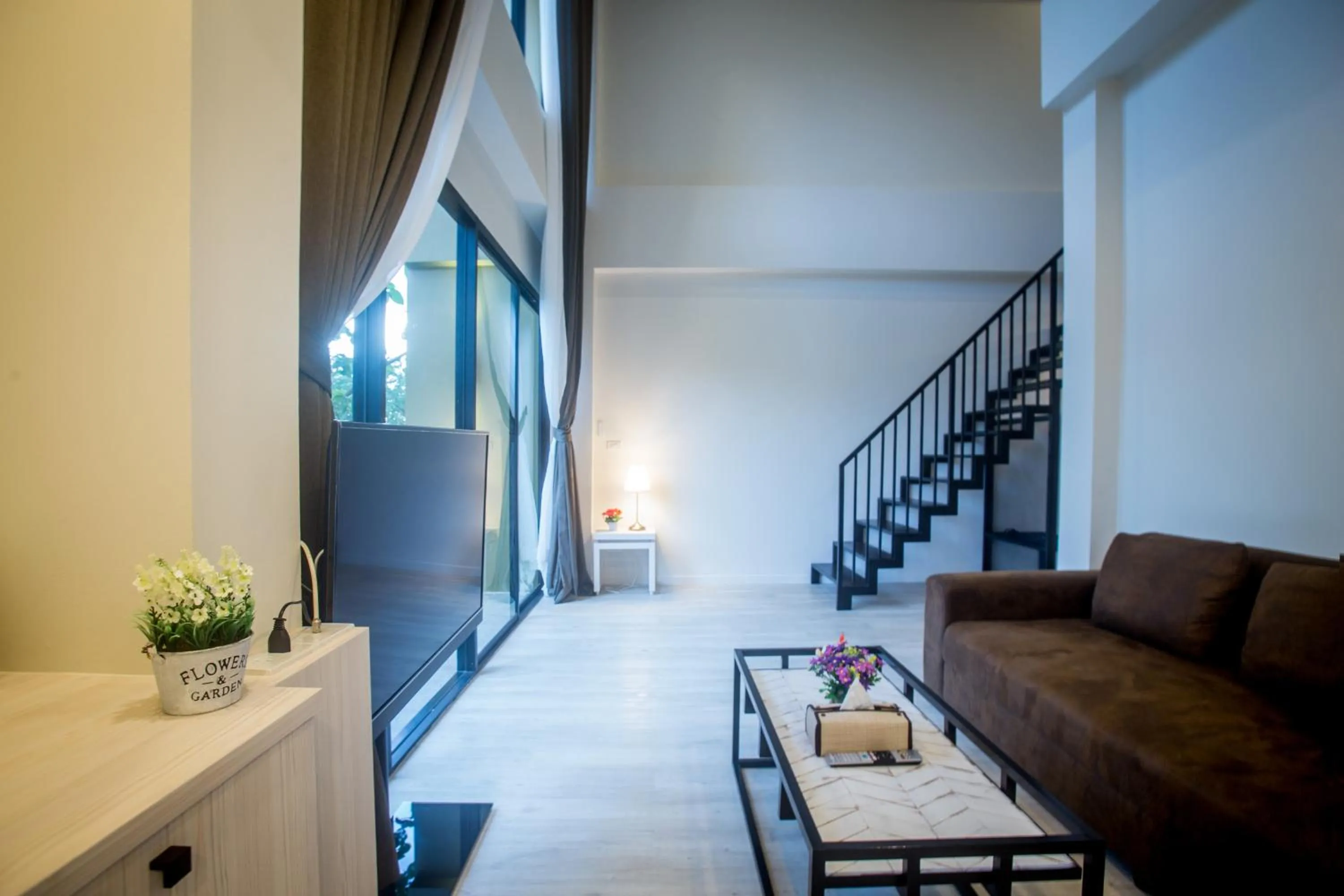 Communal lounge/ TV room in TREX Buriram Boutique Hotel