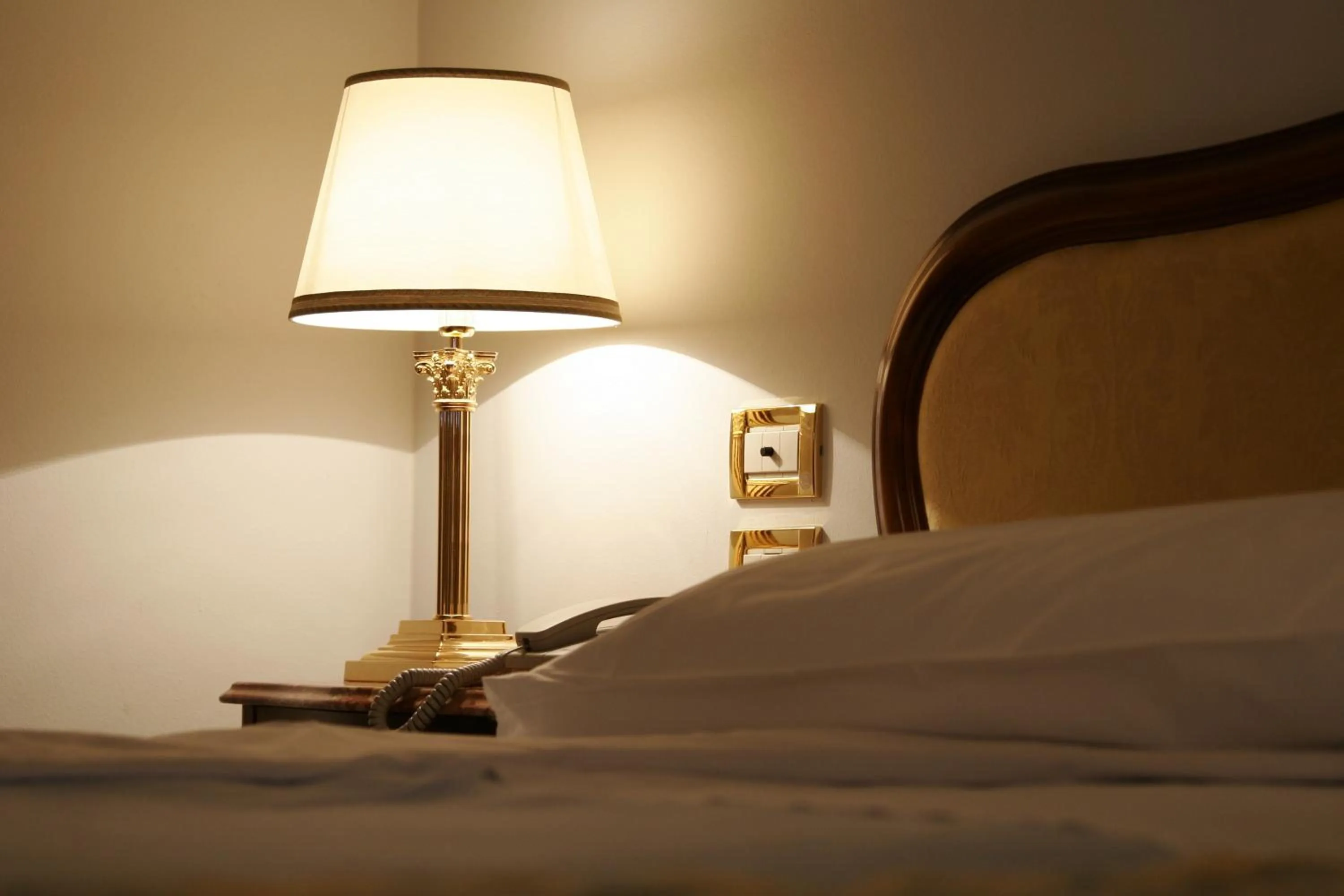 Decorative detail, Bed in Grand Hotel Trieste & Victoria