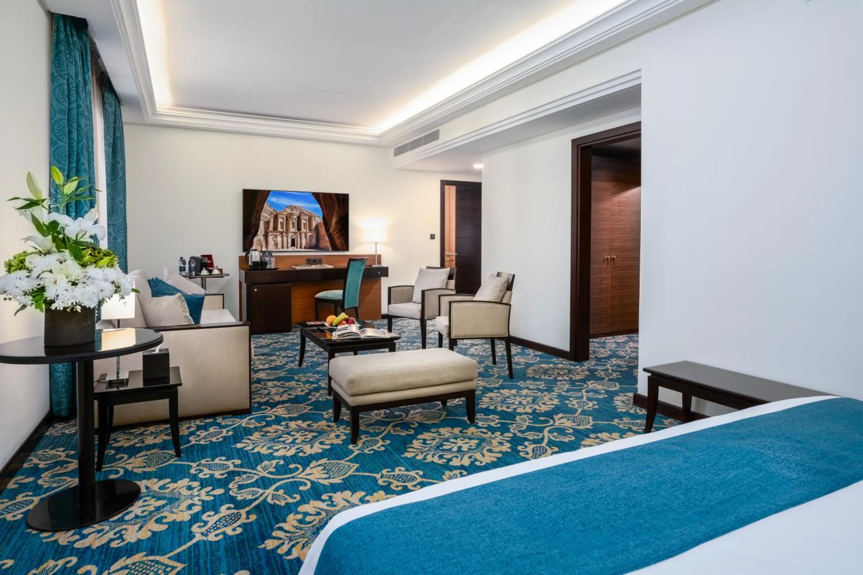 Living room, Bed in Corp Amman Hotel