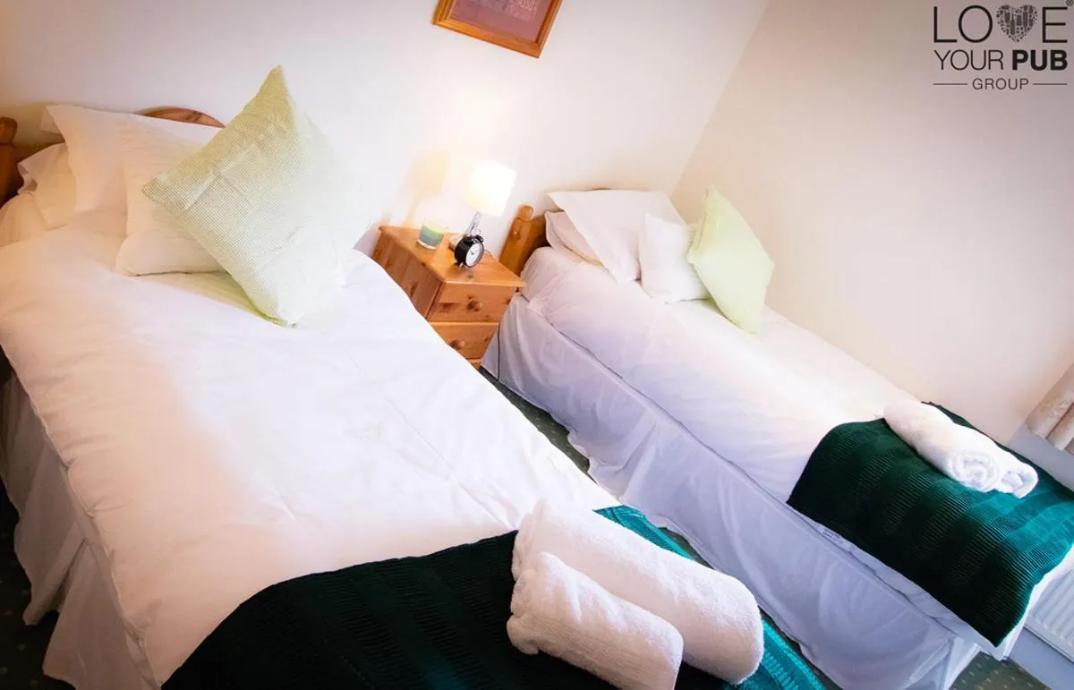 Bed in The Rising Sun Inn