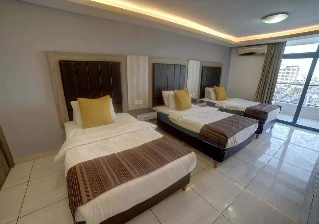 Bed in Shweiki International Hotel