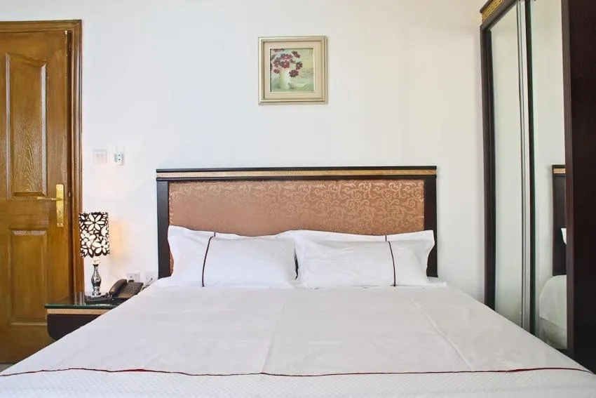 Bed in Golden Rose Hotel