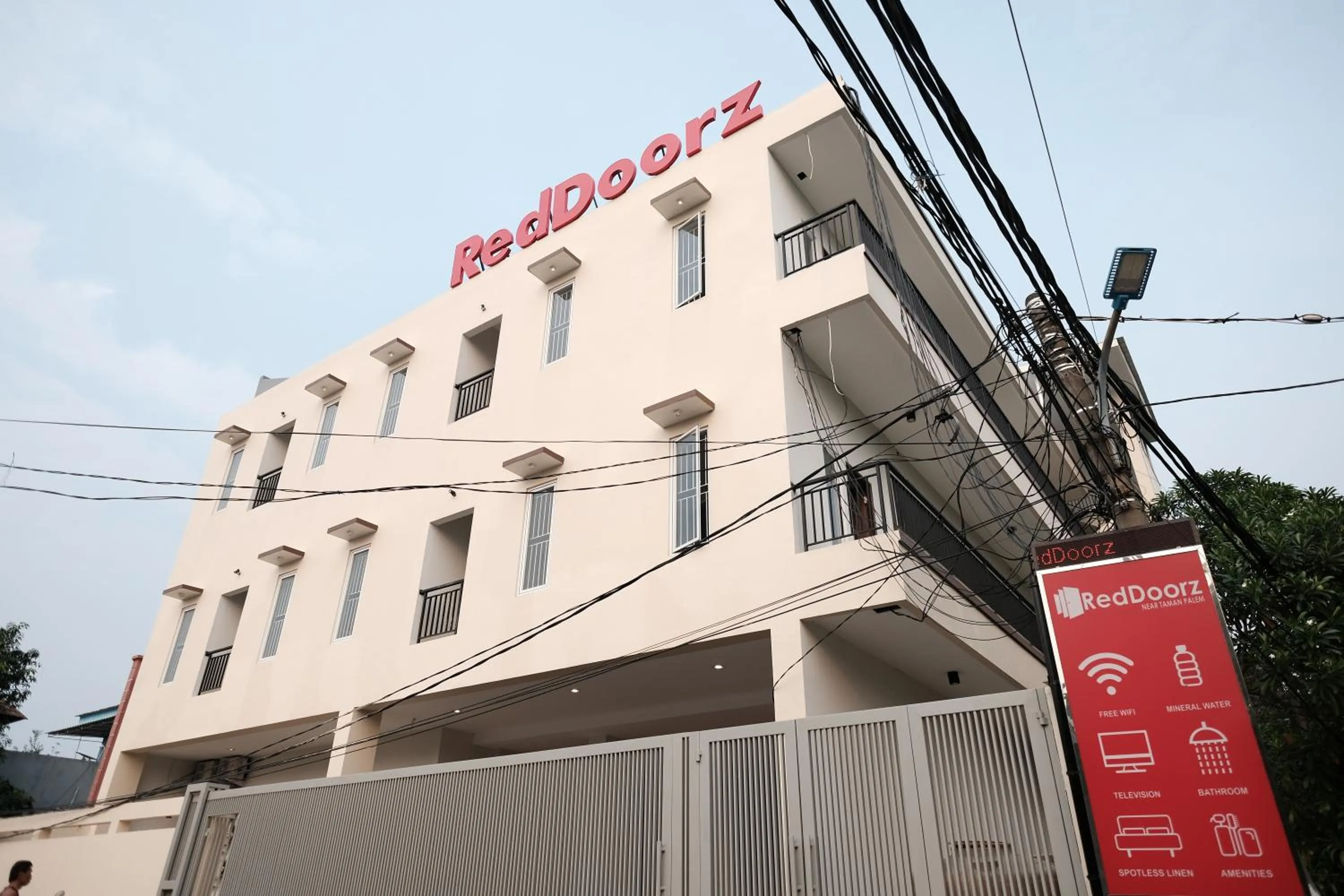 Property logo or sign in RedDoorz near Taman Palem