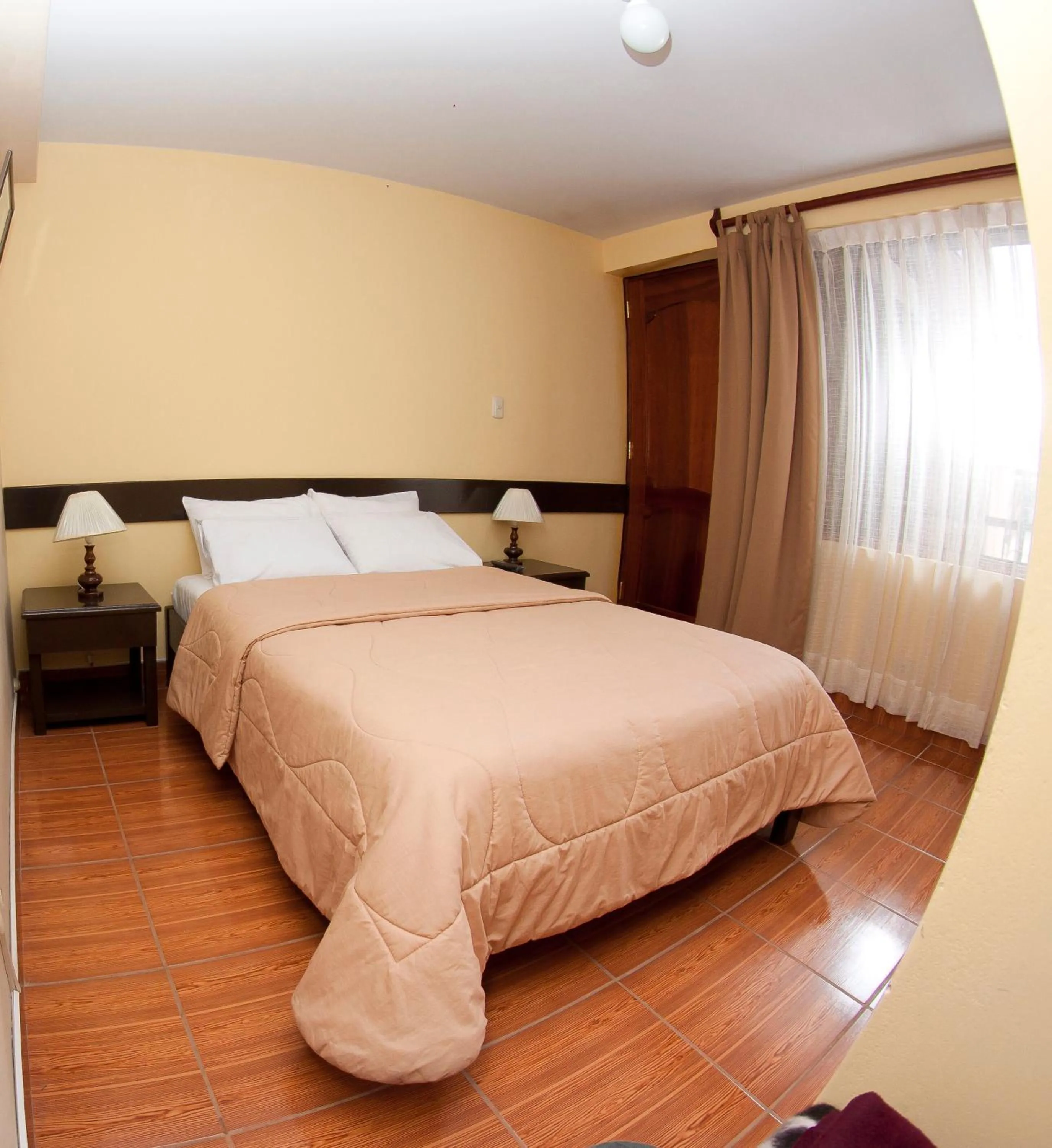 Bed in Yucay Plaza Inn