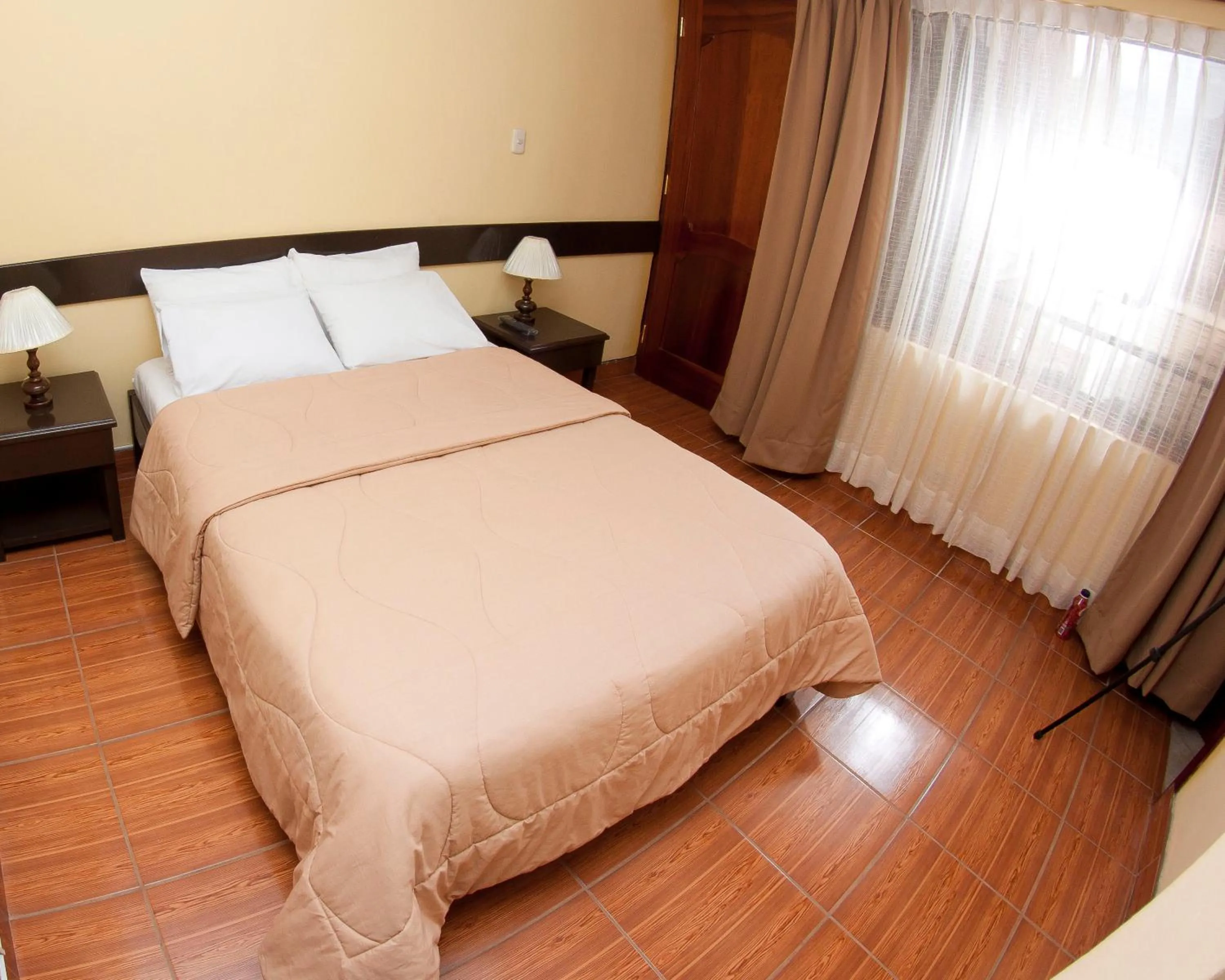 Bed in Yucay Plaza Inn