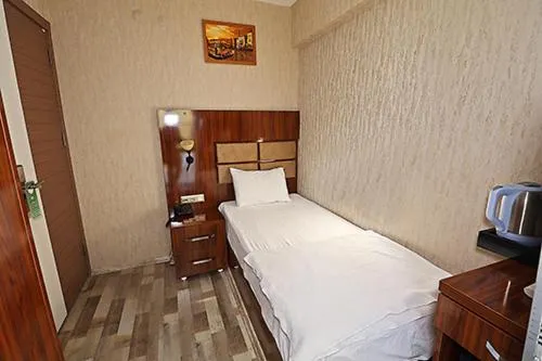 Bed in MARİNA HOTEL