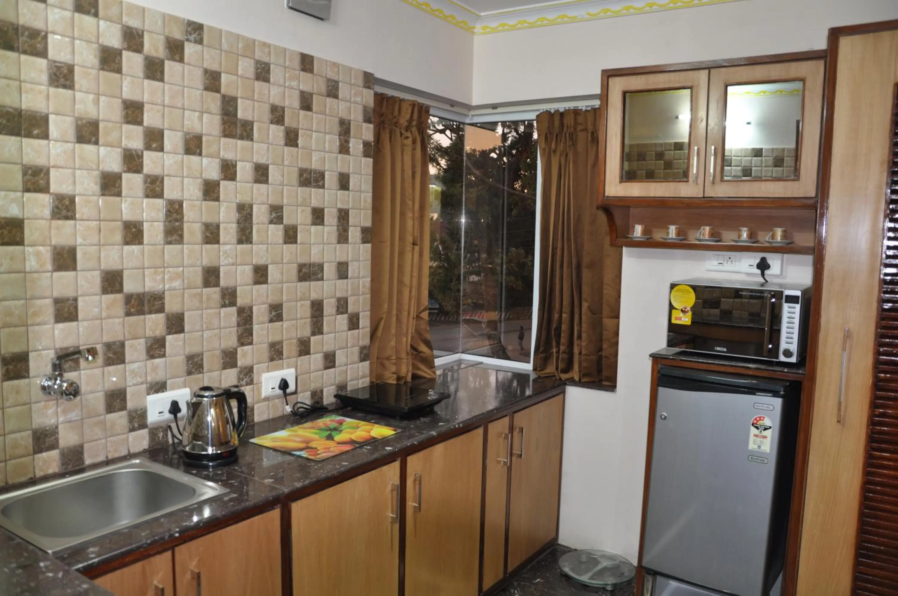 Kitchen or kitchenette in Astoria Residency