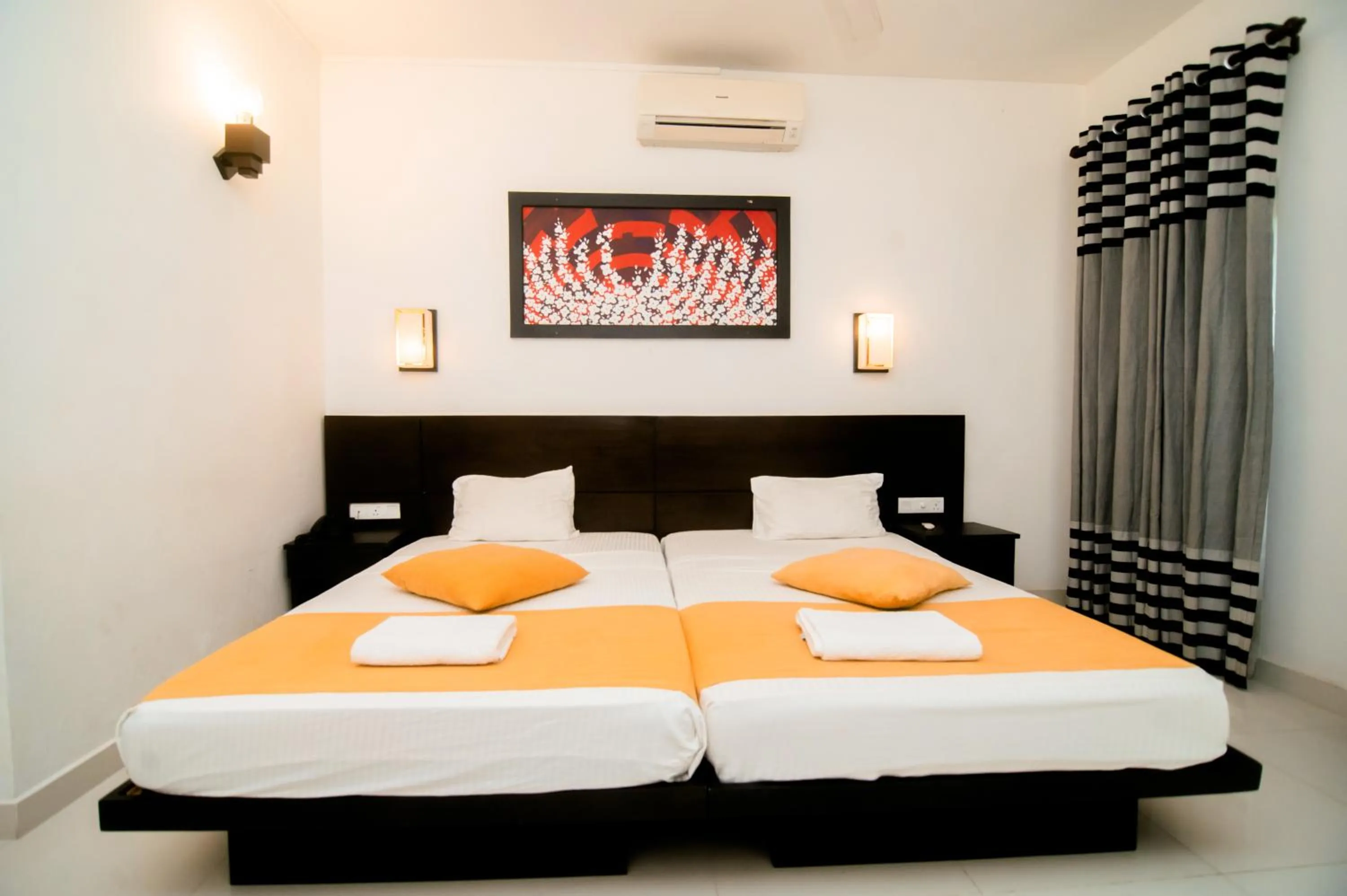 Bed in Lagoon Paradise Beach Resort