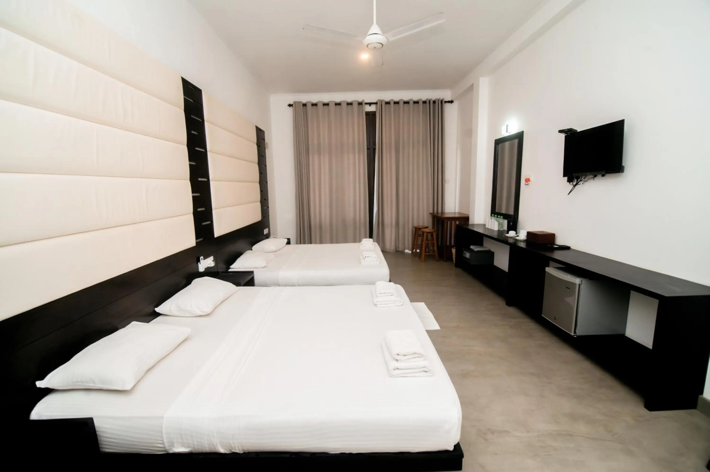 Bed in Lagoon Paradise Beach Resort