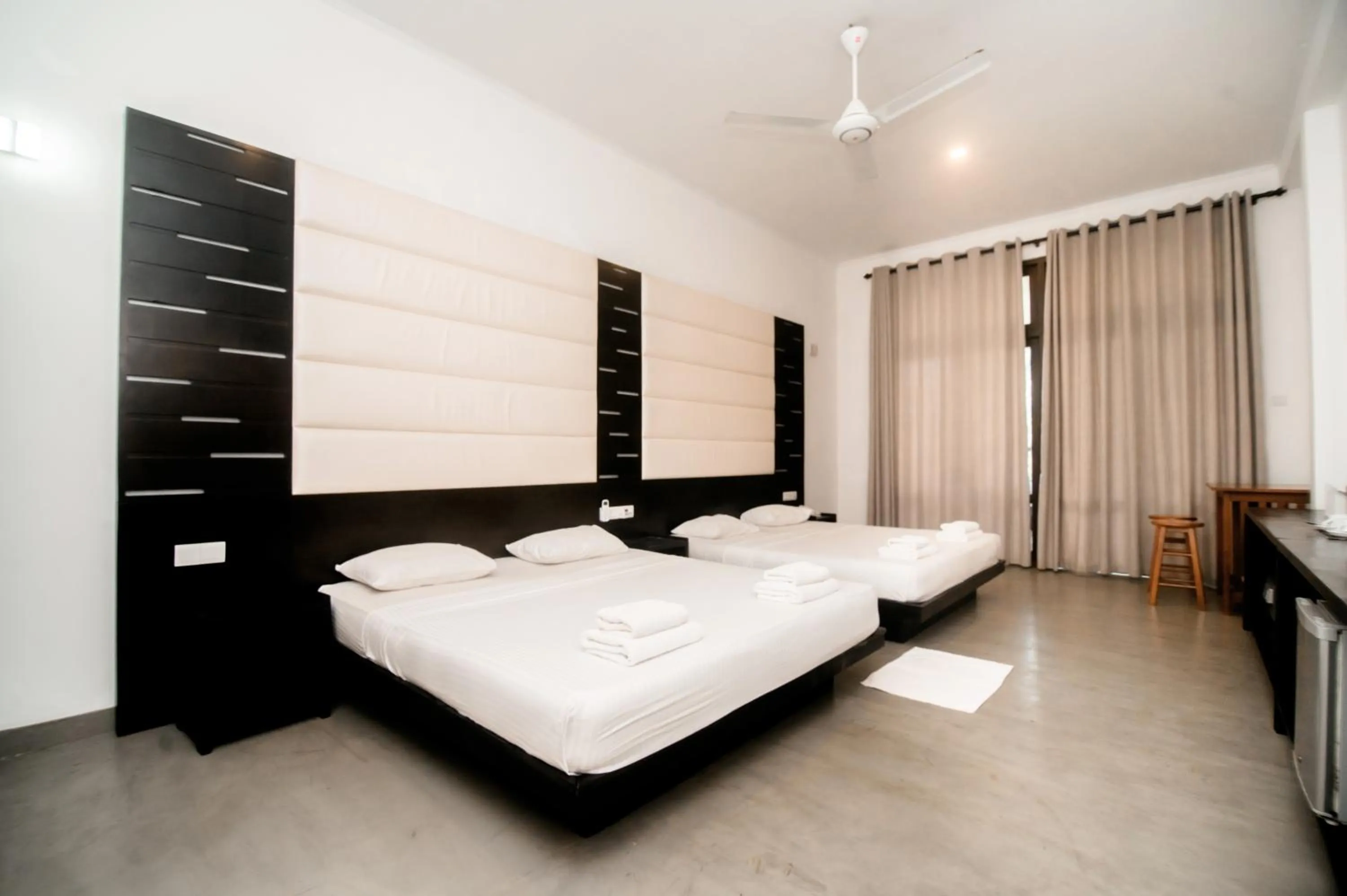 Bed in Lagoon Paradise Beach Resort