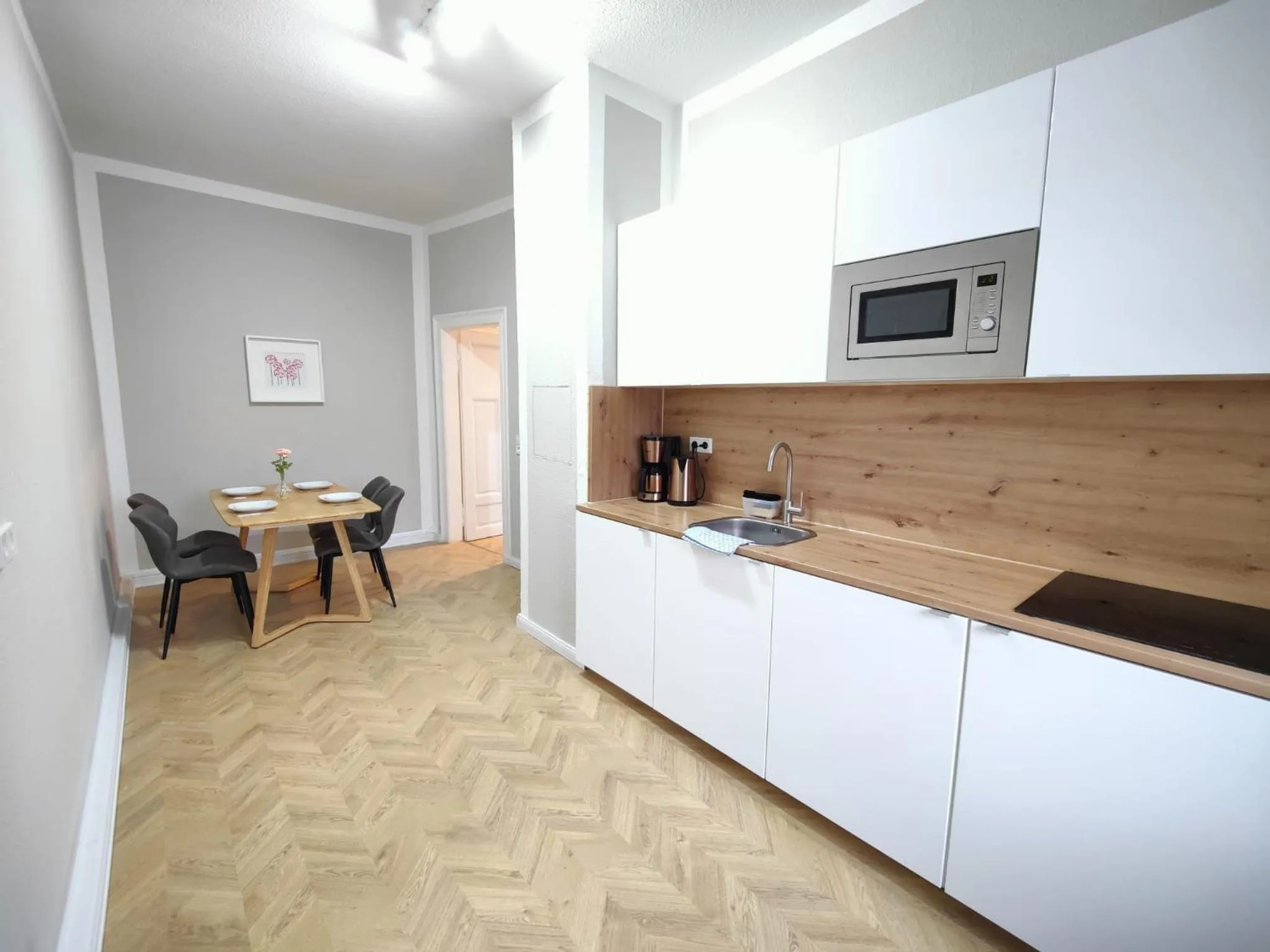 Kitchen or kitchenette in Zollikof Aparts - Sauna & Studioapartments