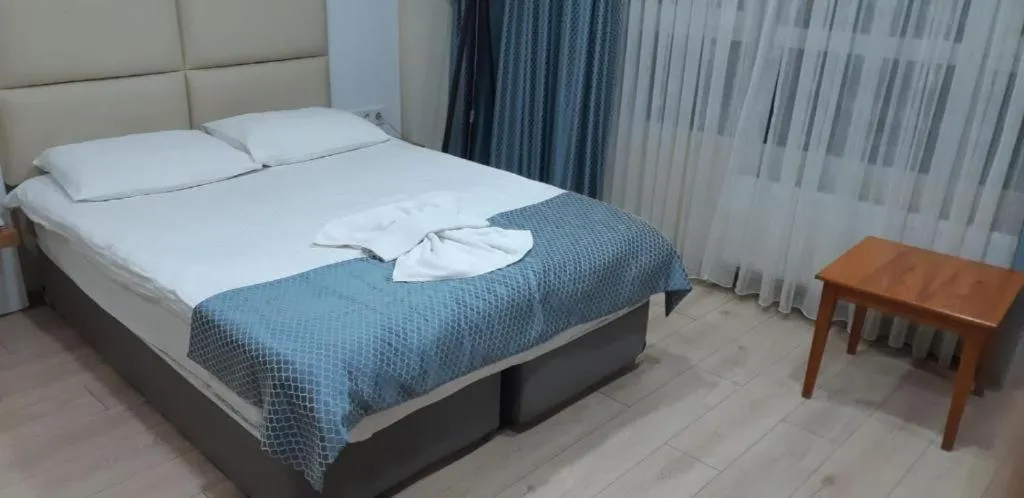 Bed in Arya Hotel