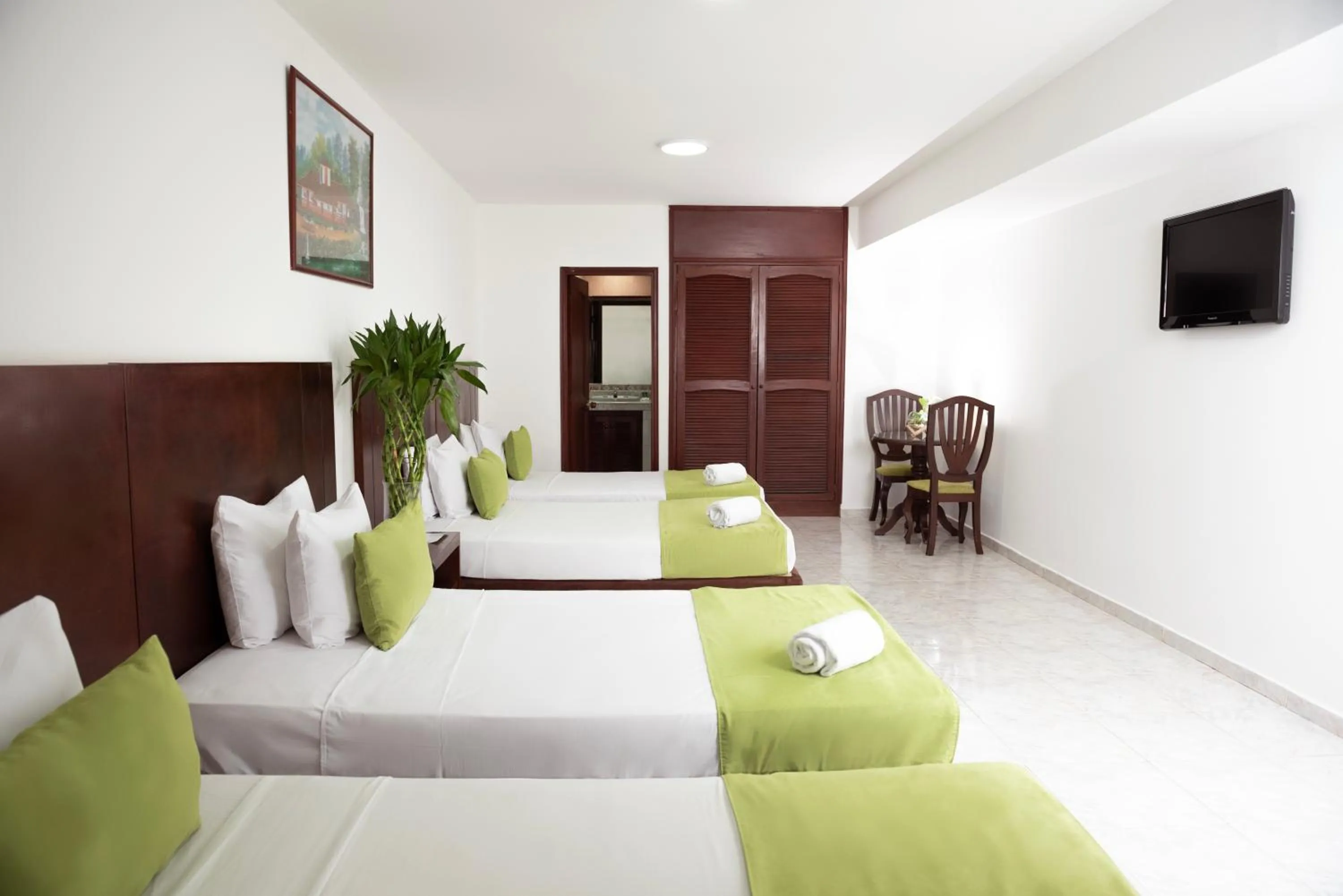 Bed in TAMA Hotel Granada Real Cali