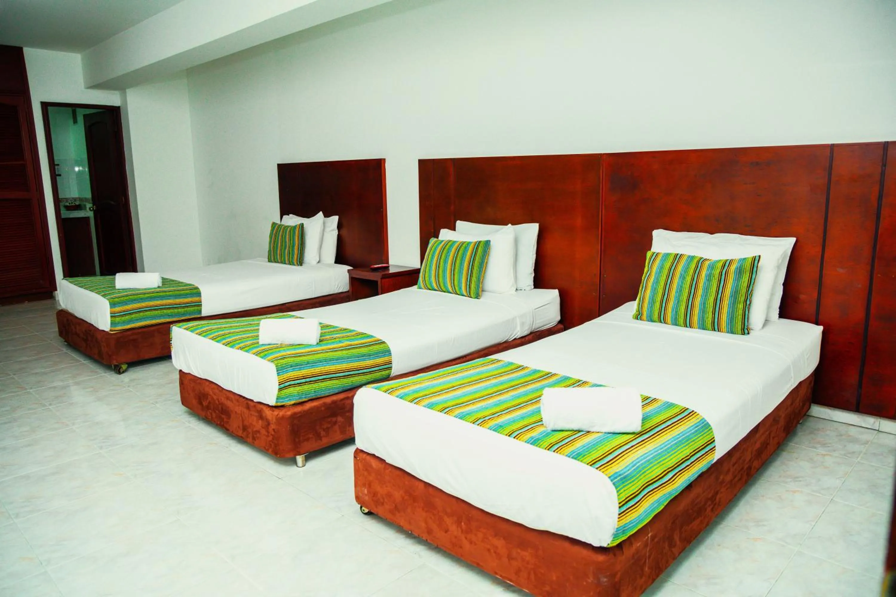 Bed in TAMA Hotel Granada Real Cali