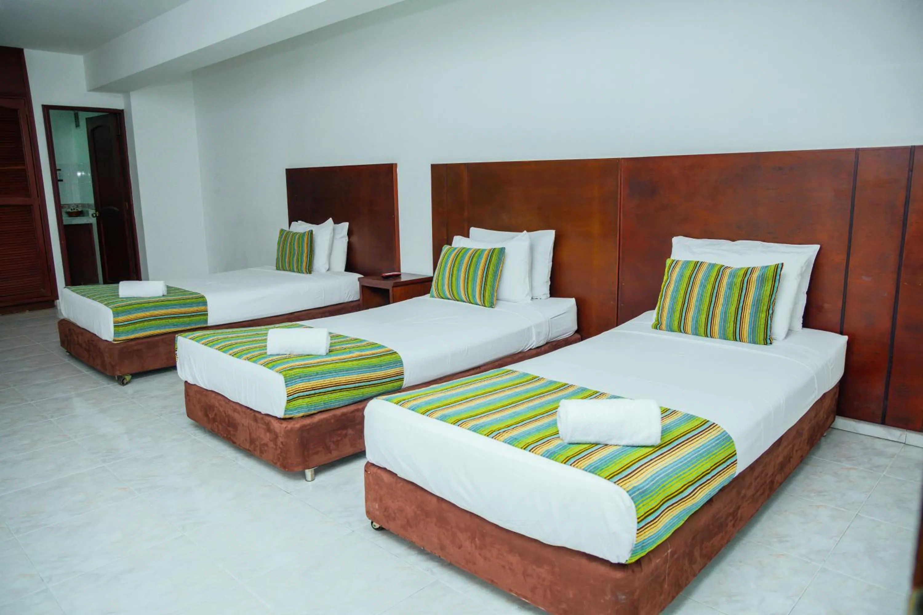 Bed in TAMA Hotel Granada Real Cali