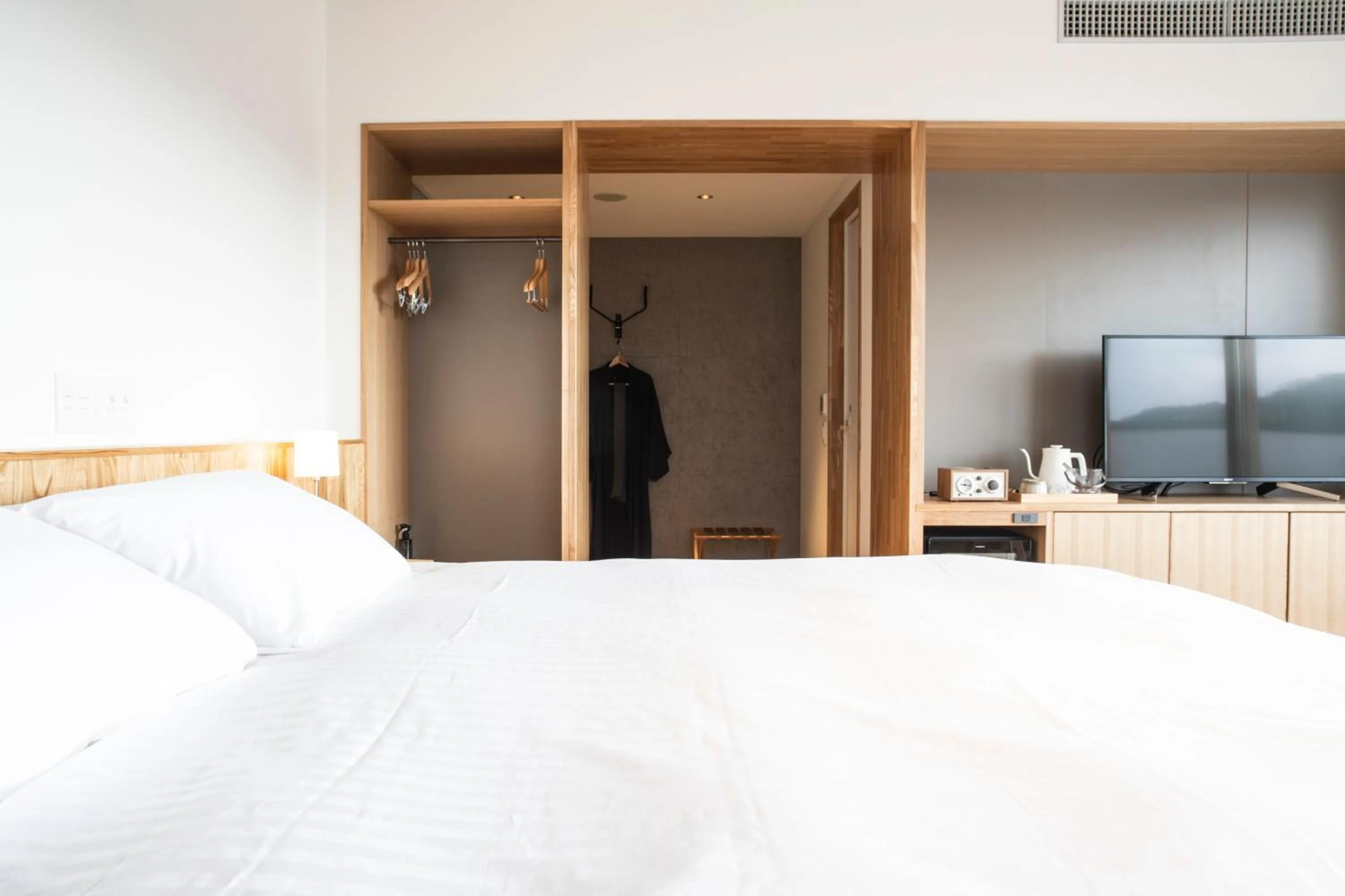 Bed in MASCOS HOTEL Masuda Onsen