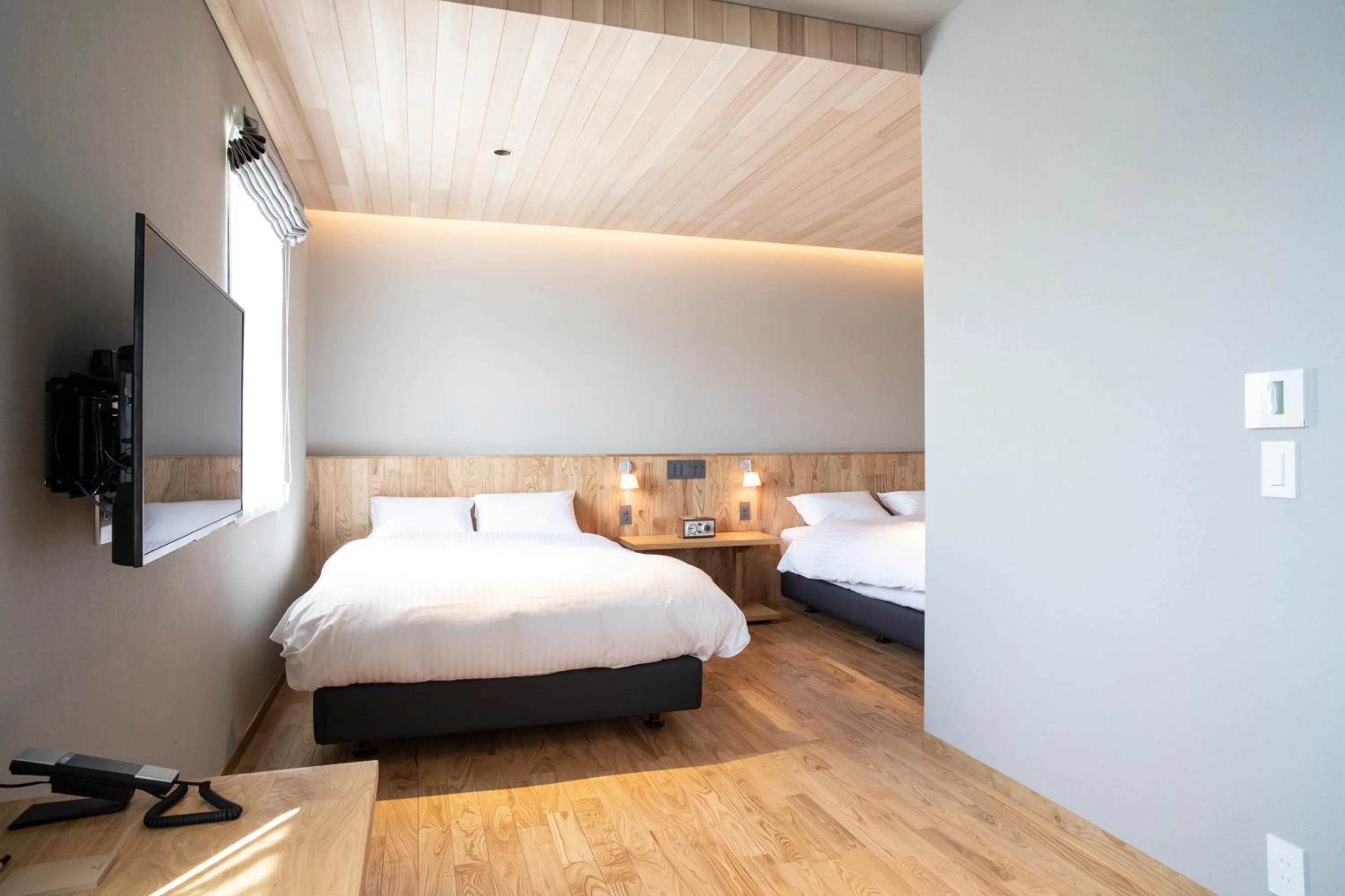 Bed in MASCOS HOTEL Masuda Onsen