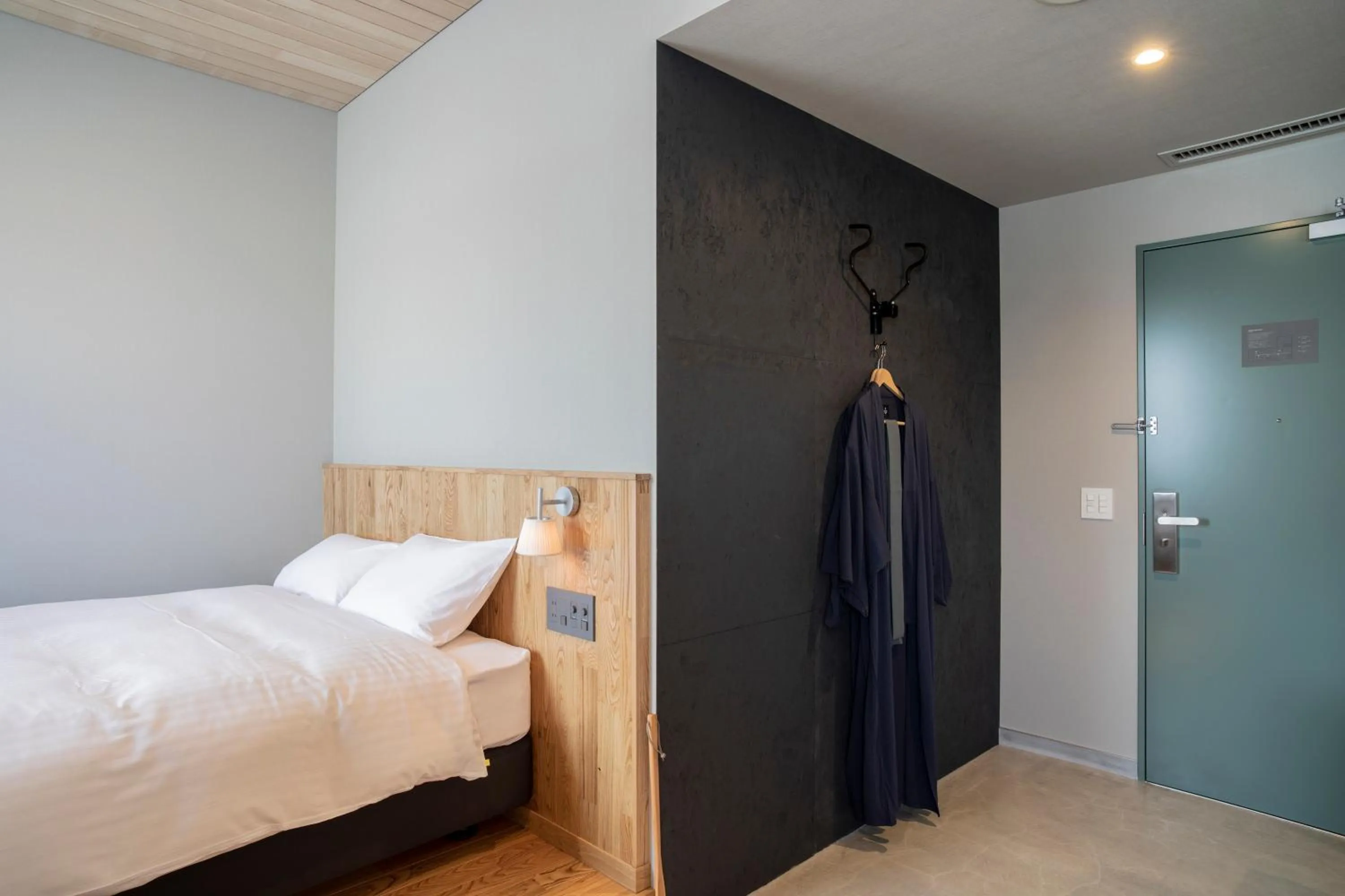 Bed in MASCOS HOTEL Masuda Onsen