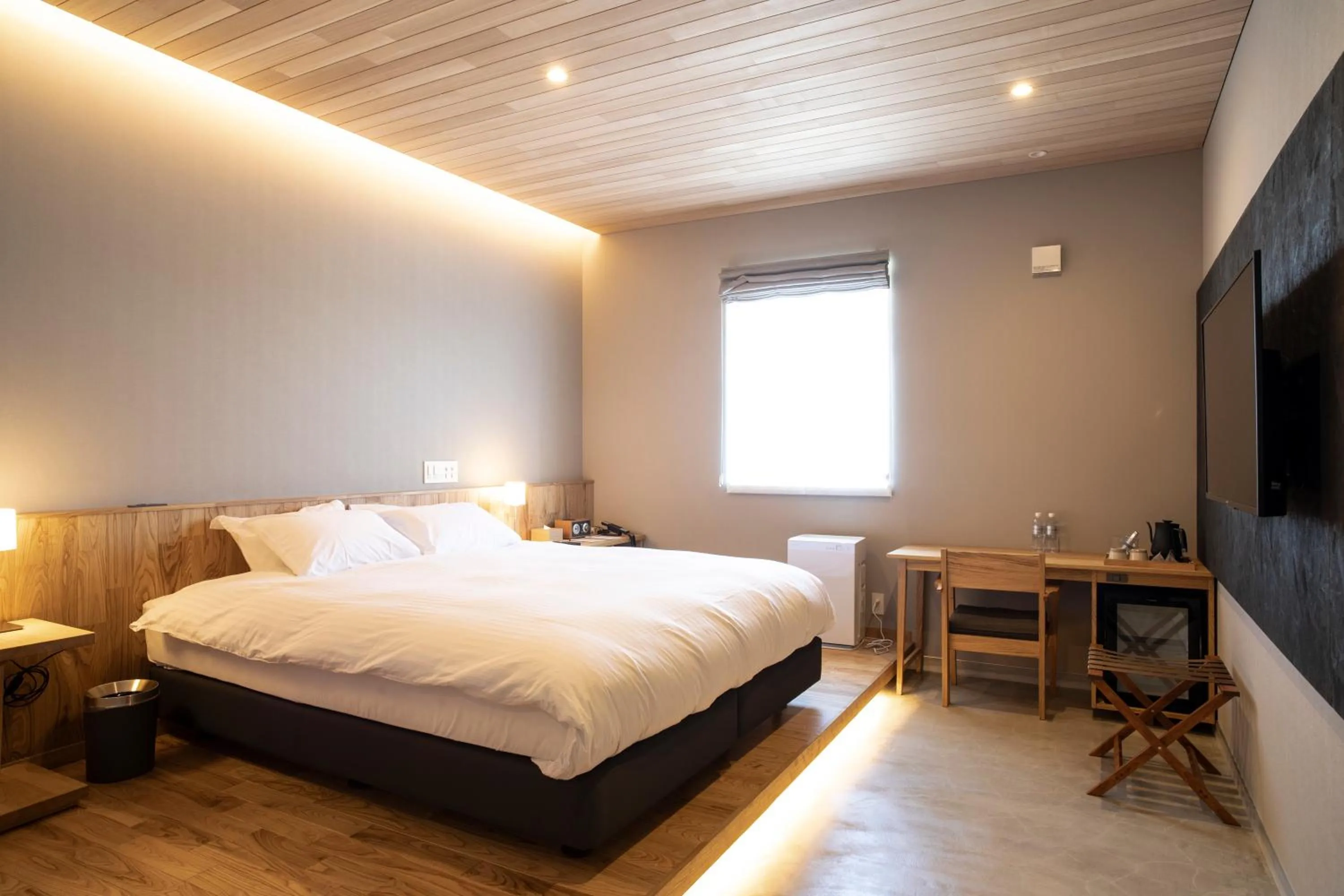 Bed in MASCOS HOTEL Masuda Onsen