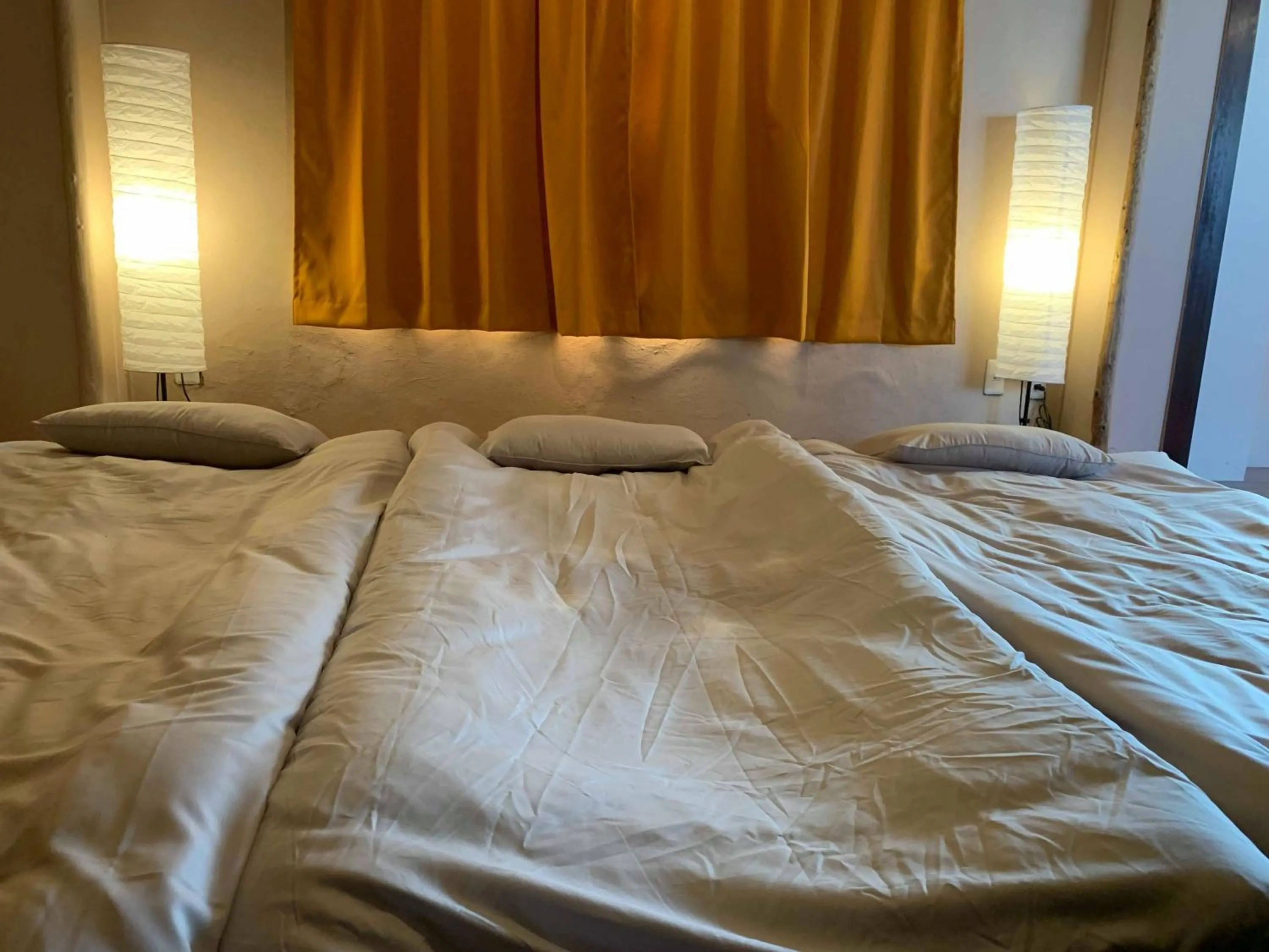 Bed in 777 Takamatsu Guest House