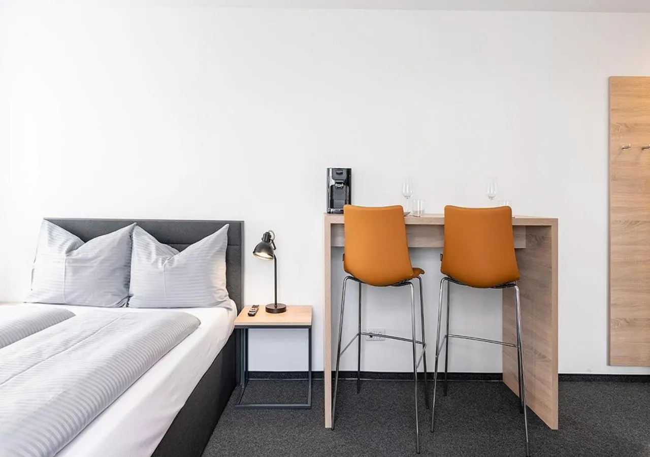 Seating area, Bed in LA serviced apartments