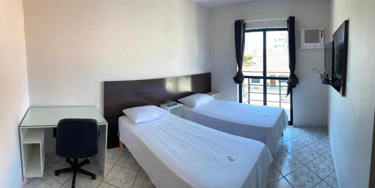 Bed in Pousada Cores