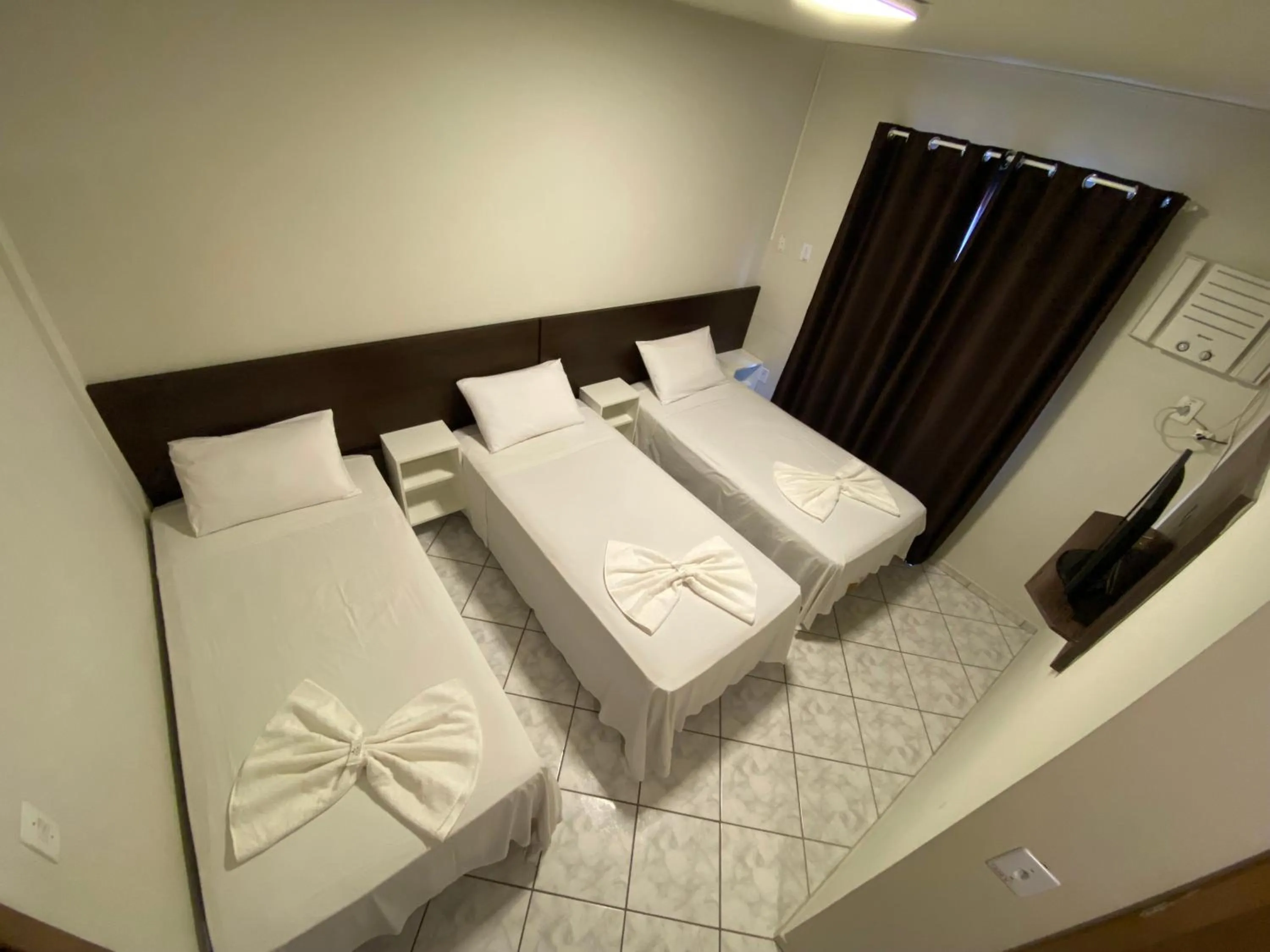 Bed in Pousada Cores